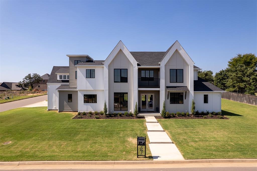 This exquisite home impresses from the moment you arrive, from the sprawling elevation to the desirable corner lot. Upon entering you'll find beautiful coffered beams adding character and charm to the expansive living room. The heart of the home is a bright and airy kitchen, complete with high-end appliances, ample counter space, and a butler's pantry featuring a secondary sink and room for an extra refrigerator—perfect for entertaining or keeping life organized. The primary suite is a true retreat, with vaulted ceilings and a spa-like en suite featuring dual shower heads and a luxurious soaking tub. Conveniently, the oversized laundry room connects directly to the primary suite for ease and functionality. Looking for a designated study? We've got you covered. A huge office with grand windows and french doors is tucked right off the entry. A second bedroom with en suite bath is also on the main level offering flexibility for guests, while two additional bedrooms upstairs provide privacy and comfort. Enjoy abundant natural light throughout the home, along with the added perks of a three-car garage and a private balcony to unwind and take in the view. This home seamlessly blends style, comfort, and practicality. Don't miss your opportunity to call this stunning property home!