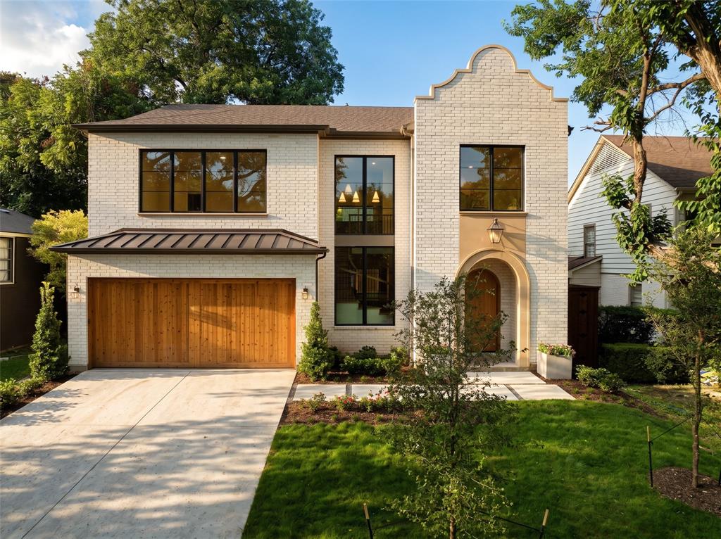 A sophisticated Modern Spanish Revival with warm organic influences. Thoughtfully designed by Ryan Jacobson Design brings to market this new construction in the heart of prestigious Lakewood,  with over 5,100 square feet of refined luxury living. This stunning 5-bedroom custom home seamlessly blends timeless architecture with today's most sought-after finishes and floor plan.A dramatic arched entry welcomes you into light-filled interiors featuring soaring ceilings, wide-plank hardwood flooring, designer millwork, statement staircase, and an effortless open-concept layout. The spacious living room is anchored by a beautiful fireplace with custom built-ins and opens to the covered patio, creating the perfect indoor-outdoor entertaining space.The chef's kitchen is the centerpiece of the home, showcasing an oversized waterfall island, premium Wolf® professional appliances, integrated Sub-Zero® refrigeration, custom cabinetry, designer lighting, and an elegant Champagne Bronze hardware package.The first-floor primary retreat offers exceptional privacy and features a spa-inspired bath with a freestanding soaking tub, oversized glass-enclosed shower, dual vanities, designer gold-toned mirrors, and an expansive walk-in closet.A private study and first-floor guest suite provide ideal flexibility for work and visitors. Upstairs offers three additional bedrooms, spacious game room, dedicated media room, and abundant storage.Built with quality in mind, the home features 2x6 exterior wall construction, foam insulation, enhanced attic insulation, premium windows, and carefully curated designer finishes throughout.Located on one of Lakewood's most desirable streets, just minutes from White Rock Lake, Lakewood Country Club, Lakewood Shopping Center, award-winning schools, dining, and shopping, this home offers the rare opportunity to enjoy modern luxury in one of Dallas' most established neighborhoods.