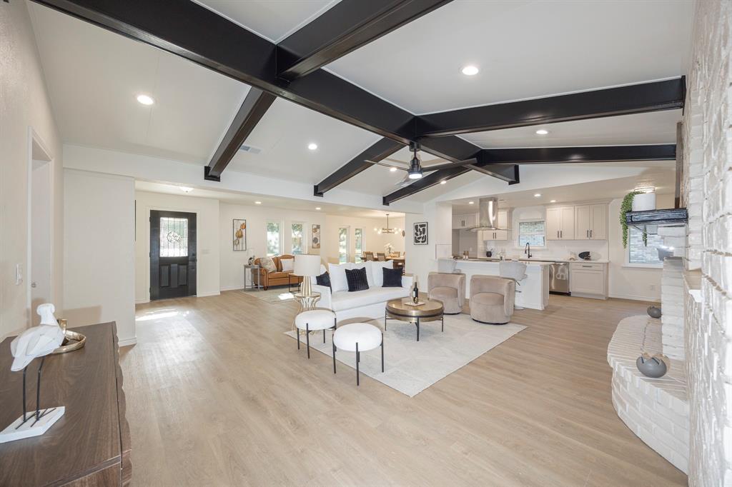 *** Fully Renovated 4-Bed Plano Home *** No HOA *** Paid-Off Solar *** Move-In Ready ***Welcome to this fully renovated 4-bedroom, 3-bath residence offering 2,344 sq ft of beautifully curated living space in the heart of Plano. Designed to blend timeless architectural character with modern luxury, this home is truly move-in ready and located in an established neighborhood with no HOA.The grand living room is a showstopper, highlighted by a dramatic wood-beamed vaulted ceiling and a stunning brick fireplace, creating a warm yet sophisticated focal point. Abundant natural light enhances the open layout, which flows seamlessly into the dining area and the chef-inspired kitchen featuring custom cabinetry, quartz countertops, stainless-steel appliances, designer backsplash, and upgraded fixtures—perfect for both entertaining and everyday living.All three bathrooms have been completely renovated with elegant designer finishes, modern vanities, tubs and showers. Luxury vinyl plank flooring, fresh interior and exterior paint, and stylish updated lighting elevate the home’s cohesive, contemporary aesthetic.Major upgrades provide long-term peace of mind, including updated plumbing, a fully replaced roof, and foundation repairs with transferable warranty. The home also features paid-off solar panels, offering immediate energy efficiency and reduced utility costs.Enjoy outdoor living with fresh landscaping and a spacious yard, all within highly rated Plano ISD. Conveniently located near parks, premier shopping, dining, and with quick access to US-75, George Bush Turnpike, and Dallas North Tollway, this home offers effortless connectivity across the DFW metroplex.A rare opportunity to own a fully renovated, architecturally distinctive home in one of Plano’s most desirable locations.