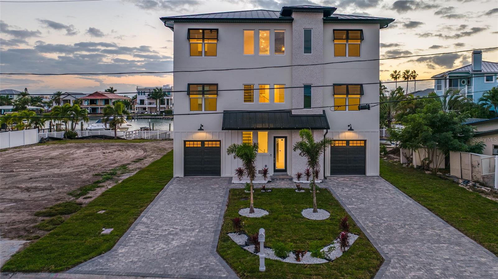BOATERS PARADISE- DEEP WATER!....Brand New Waterfront Masterpiece — This brand new construction has just been completed and is priced to sell. Offering exceptional value for discerning buyers who crave space, privacy, and endless entertainment. Nestled along the water, this never-before-lived-in home captures luxury and modern practicality with a spacious six-bedroom, six-bath floor plan designed to accommodate hosting friends and family while ensuring everyone has their own sanctuary. The result is a flowing, open-concept design that invites effortless entertaining and everyday living, with a dedicated media room for cinema-grade nights and a thoughtfully appointed home office to support work-from-home needs.The six bedrooms and six baths provide rare flexibility, from guest suites to in-law arrangements or private spaces for multi-generational living. The primary suite is a retreat in itself, featuring a spa-like ensuite and expansive closet space with tranquil water-facing views. The incredible chef-inspired kitchen showcases premium appliances, a large island, walk-in pantry, and finishes that elevate daily living to a luxurious experience. Throughout the home, modern, high-end finishes, smart-home wiring, and designer touches create an ambience of refined sophistication. Waterfront living is at the heart of this home, with serene water views visible from multiple rooms and the promise of outdoor entertaining that extends beyond the indoors. The exterior presents a clean, modern aesthetic with durable, low-maintenance materials, and ample yard space ready for landscaping enhancements, a saltwater pool with heating and cooling feature complete with a raised jacuzzi and additional outdoor lounge areas. Location-wise, you’ll enjoy a prime waterfront neighborhood with easy access to boating, close to the Beach and nearby shops and restaurants. The area combines a quiet, prestigious community feel with modern conveniences, including proximity to top-rated schools, dining, and recreation. From a price-to-value perspective, this new build represents exceptional value for a waterfront property of this caliber, with warranties and builder oversight providing peace of mind and ready occupancy upon escrow closing. This home is a true sanctuary built like a fortress, all block construction on a 3-tier foundation to give you peace of mind. Realtors, bring your pickiest buyers, they will not be disappointed!