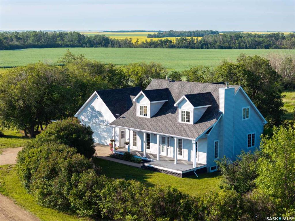 Beautiful 10-acre country retreat near Hepburn and Dalmeny– private, peaceful, and perfect for horses. Just minutes from Hepburn and a short drive to Saskatoon, this original-owner, 1,944 sq ft custom-built 2-storey offers 4 bedrooms, 3 baths, a double attached garage, and a mature, tree-lined yard with fruit trees and landscaped grounds. Enjoy the true value of acreage living — room to breathe, abundant wildlife and songbirds, and the serenity that comes with wide-open space and privacy, all while having the convenience of the school bus stopping at your door. Inside, enjoy a bright farmhouse-style kitchen updated in 2024, spacious dining area, sunlit living room with wood-burning fireplace, and a separate den (which could be made into a main floor bedroom). Upstairs features a large primary suite with walk-in closet, ensuite, and makeup vanity, plus an office or potential 5th bedroom. The fully finished lower level offers three large bedrooms, full bath, and versatile living space. Updates include shingles (2017), HRV (2022), central air (2016), water pressure pump (2020), electric boiler with low average bills , Starlink internet, and video security. Extras: all appliances, two laundry sets, 4-year-old generator, dog run, and play structure. Subdivision for the 10 acres will be finalized with the sale; seller may offer additional adjoining land. Quick possession available—shows 10/10.