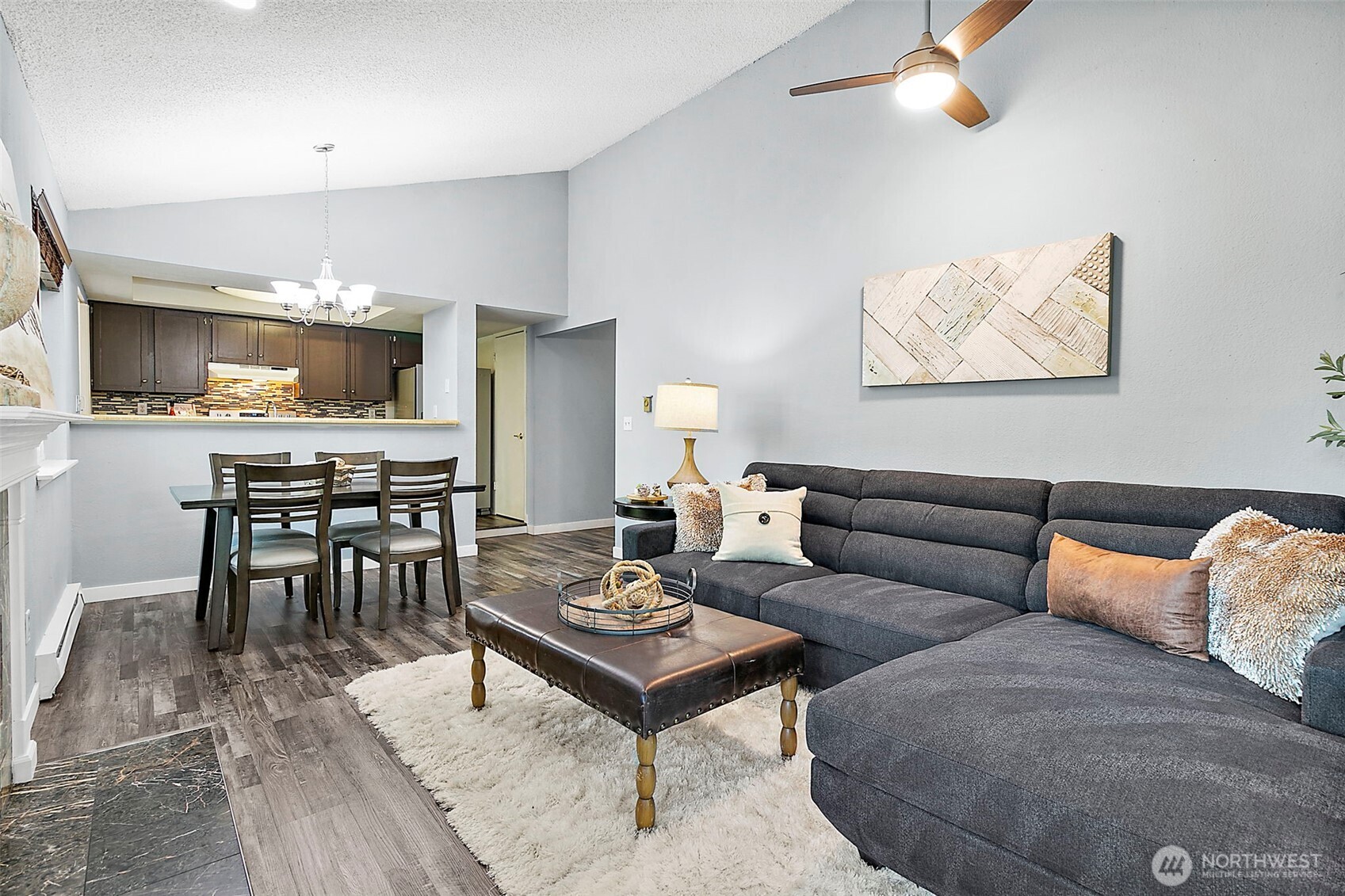 One Buyer's Loss is your Opportunity! Welcome to this spacious & well-maintained condo in the heart of Kent! Step into a bright, open layout featuring a cozy fireplace, large living & dining areas, and private balcony w/peaceful greenbelt views. All generously sized beds, offering comfort and flexibility. The oversized primary includes a full ensuite bath and closet space for privacy and convenience. You’ll love the abundance of storage throughout the home, along w/in-unit laundry and large windows that fill the space w/natural light. The community landscaped grounds, a sparkling pool, and easy access to shopping, dining, parks, and transit. Whether you're settling into your first home or looking for low-maintenance living in a prime location, this home checks all the boxes.