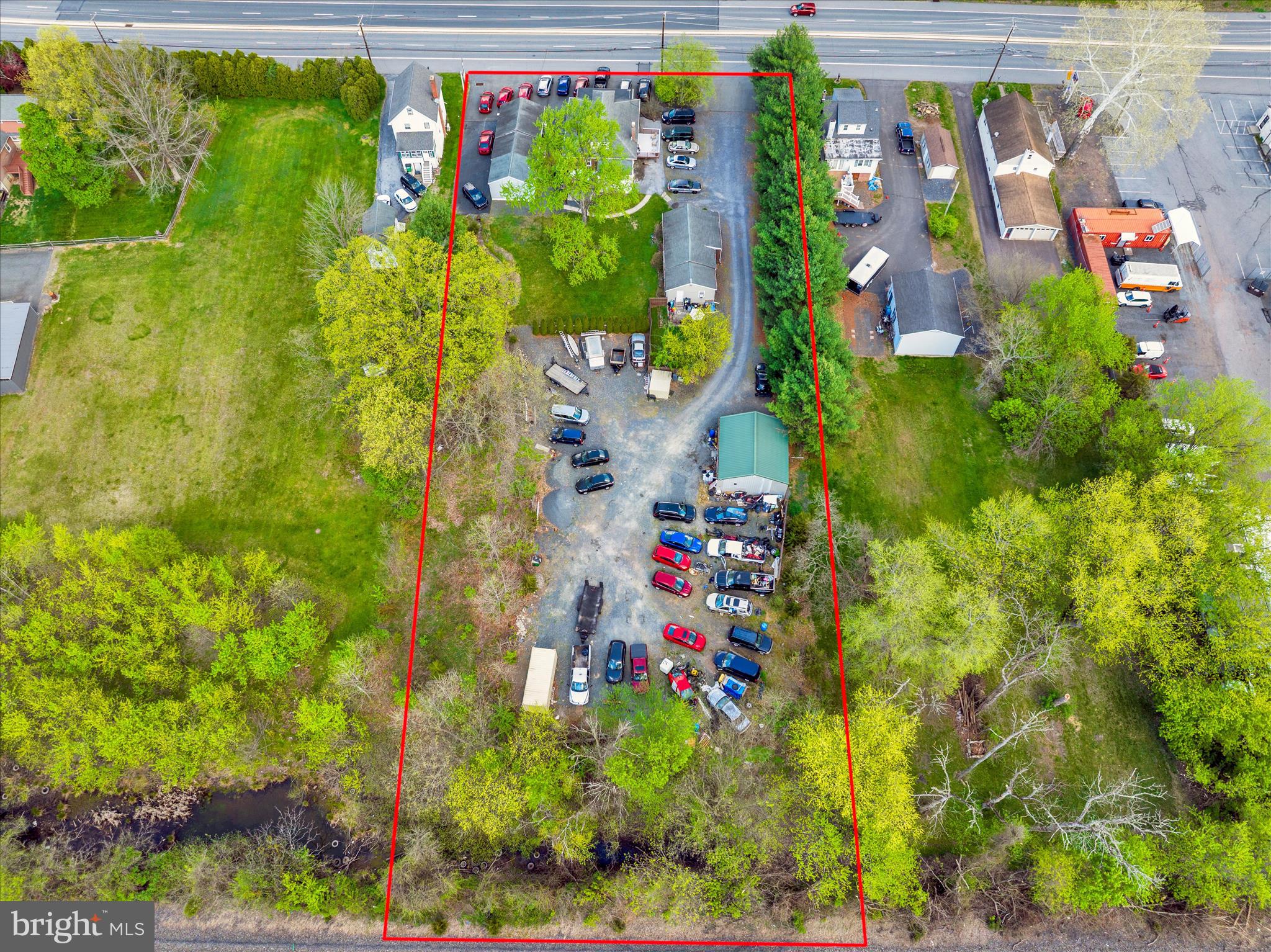 Commercial investment property with 1.33 acres. 5 current rental incomes including 3 residential units, 1 car lot and 1 pole barn. Additionally you can rent space out in the rear of property for more income. Total income as of end of 2025 is $49,980. This is a money maker and a great opportunity! (well water, public sewer, natural gas) (Property is fully rented month to month).