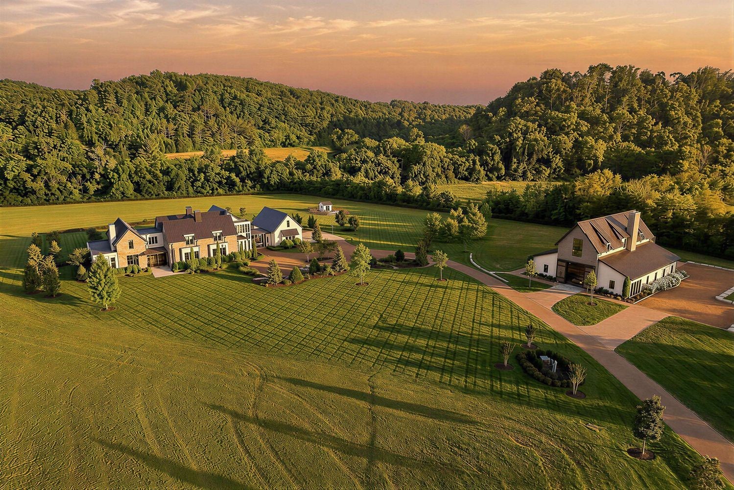 Drive into your happy place, slow down and live deliberately on this spectacular Modern Farmhouse Estate just south of Leiper's Fork. Designed by Pfeiffer Torode architects, Entertainers will delight in the thoughtfully integrated entertaining spaces throughout the main house while Car enthusiast will be elated over the newly constructed Car Barn across the property. Character-grade oak floors and hand-hewn ceiling beams create a natural and understated look inside while the organically inspired architecture affords privacy within the landscape of sprawling pastures, meandering creeks and the rolling hills. Natural light pours through expansive windows and sliders across interior spaces affording strategic sight lines from every room. A beautiful stone porte-cochere leads to a four (4) car detached garage with heated & cooled Expansion or Storage space above.The current owners intentional design additions have made this spectacular home extraordinary. A 560 Bottle glass enclosed wine cellar with coordinating tasting bar separates the formal dinning area from a beautiful back kitchen/butlers pantry with sunset views. A new private patio and entry from the Primary suite was a must. New travertine stone hardscape surround for the infinity edge pool and outdoor spaces creates a more spa like feel outdoors. And the piece de resistance....the newly constructed 5500 SqFt Car and Entertainment barn complete with its very own simulator room, laundry and second story entertaining guest quarters with full kitchen, billiards, bedroom and more. The car barn was designed to safely and securely house the most discerning of collections.A list of notable features is attached as there are so many to mention.