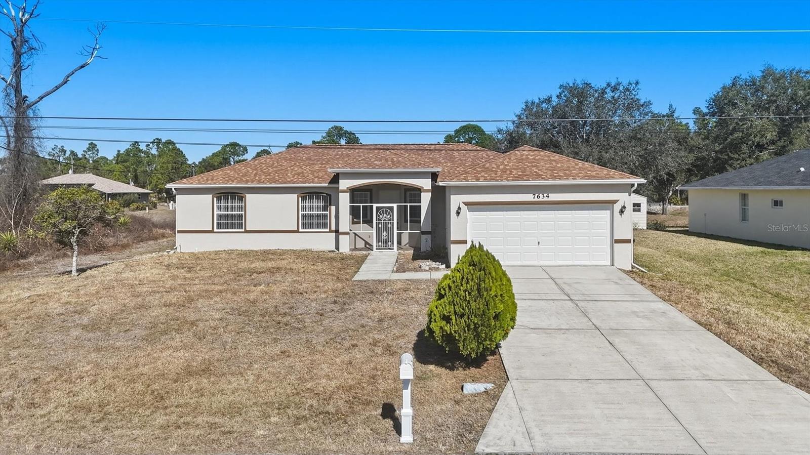 This beautifully maintained 3-bedroom, 2-bath home offers 1,827 square feet of comfortable living space with a desirable split floor plan. Featuring high ceilings and fresh interior and exterior paint, the home feels bright and inviting throughout. The open kitchen flows seamlessly into the main living areas and includes a cozy breakfast nook perfect for casual dining. Step outside to enjoy the screened-in pool, ideal for relaxing or entertaining year-round. Additional highlights include a spacious 2-car garage and a large shed providing plenty of storage space.