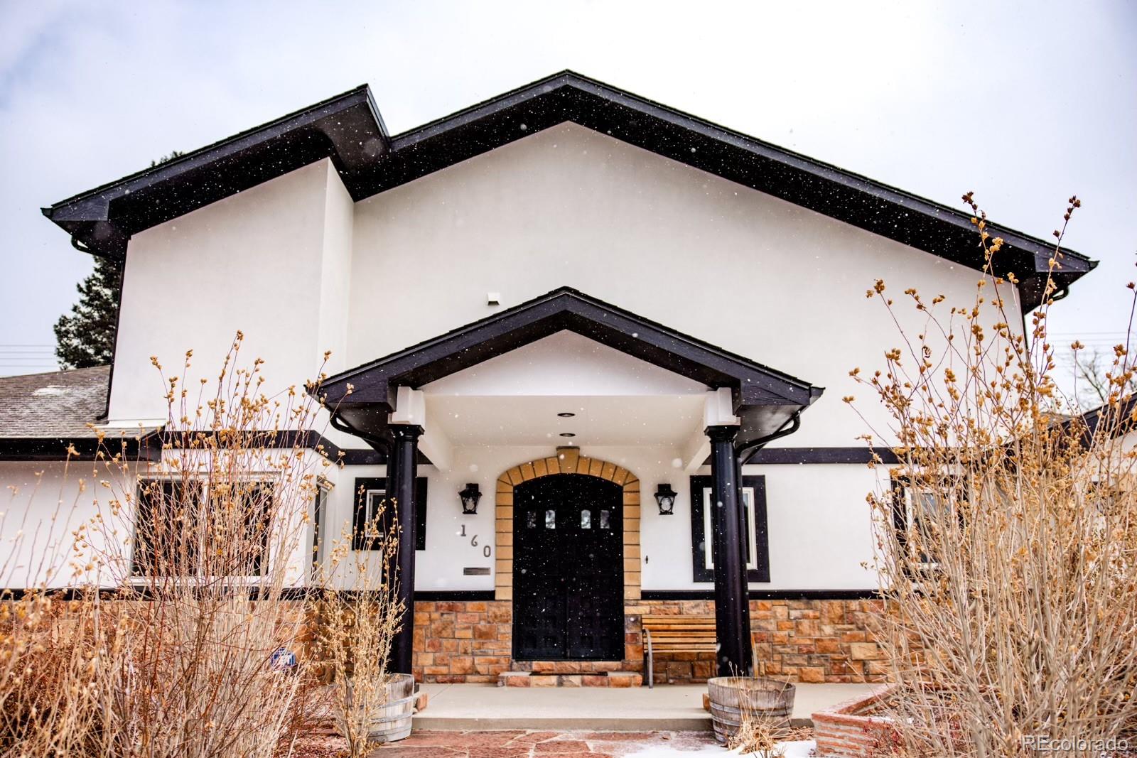 Wonderfully unique custom home on a coveted double lot in Hilltop. This sprawling ranch stuns from the moment you arrive, beginning with one-of-a-kind cast iron double entry doors that open to a breathtaking Great Room with soaring vaulted ceilings and abundant natural light. Fully remodeled down to the studs in 2010 using top-tier finishes, this home blends grand scale with refined craftsmanship throughout.The expansive Great Room-perfect for entertaining—features elegant chandeliers, a massive slate stone fireplace, and oak hardwood floors, creating a dramatic yet inviting centerpiece. Just off the Great Room is a spectacular chef’s kitchen, highlighted by a single-slab Brazilian granite countertop (no seams), custom cherry cabinetry, and high-end stainless steel appliances including a 6-burner American gas range with Wolf hood, Kenmore Elite refrigerator and freezer, and KitchenAid dishwasher and microwave. Additional features include an island, 6 person breakfast bar, Pella faucets, Elkay sinks, and a solar skylight.Tucked nearby are a pvt office/study with skylight and a convenient laundry room. The south wing of the home offers a serene primary retreat with a French-inspired gas fireplace, leading to a luxurious primary bath with an oversized Kohler soaking tub, expansive granite shower, and massive walk-in closet. Three additional generously sized bedrooms and baths—two en suite—complete the home, all featuring Brazilian granite and slate tile finishes.Outdoor living is equally impressive, with a covered patio, open flagstone patio with fire pit, and a fully equipped outdoor kitchen with plumbed gas grill and gas fireplace—ideal for entertaining. The spacious backyard backs to the alley and includes a double gate for easy access.Additional highlights include a new roof, new exterior paint, updated plumbing, electrical, and sewer line (2010), two furnaces, central A/C, new skylights, abundant attic storage, and a charming cedar closet.