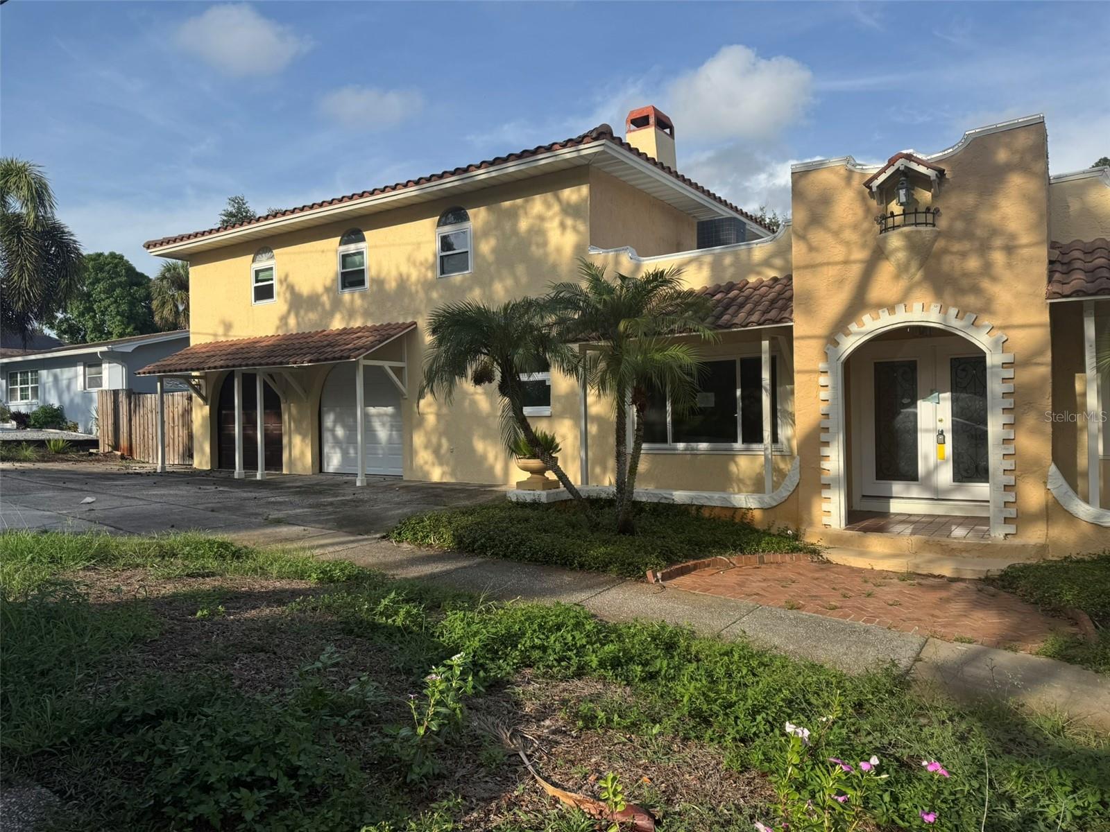 Rare opportunity to bring a distinctive piece of Tarpon Springs history back to its former glory! Built in 1920, this Spanish/Mediterranean-style home is situated on an approximately .34-acre lot in the desirable Inness Park neighborhood and offers 5 bedrooms, 5 bathrooms, a private pool and a detached one-bedroom in-law suite.The detached in-law suite features its own private entrance, bedroom, bathroom and kitchenette, providing excellent flexibility for extended family, guests, a private home office or other permitted uses.The main residence is filled with character and offers an impressive amount of space and versatility. Features include a custom kitchen with granite countertops and gas cooktop, spacious sunroom with access to the screened lanai and pool area, oversized 2-car garage with workshop, double driveways, boat/RV parking, abundant storage and a large fenced backyard with fire pit and garden areas.The home is currently vacant and needs some TLC, general maintenance and cosmetic attention, but offers tremendous potential for a buyer with the vision to restore and enhance its unique character. The pool also requires cleaning and servicing.Conveniently located near schools, parks, shopping and dining, with easy access to Sunset Beach, Fred Howard Park and Tarpon Springs' historic Sponge Docks. With its historic architecture, generous lot, private pool, detached in-law suite and unique outdoor spaces, this property offers a rare combination of character, space and versatility. Property is being sold As Is.