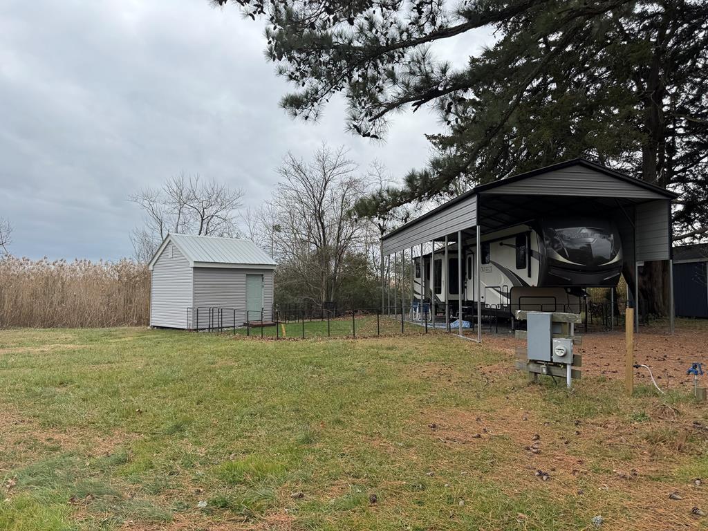Two side by side cleared lots.  Nice fifth wheel on site in great condition.  Shed on site.  Includes access to pool, dock, fishing pier, crabbing pier, marina, clubhouse, boat ramp, boat slips, playground, pavilion, and more.