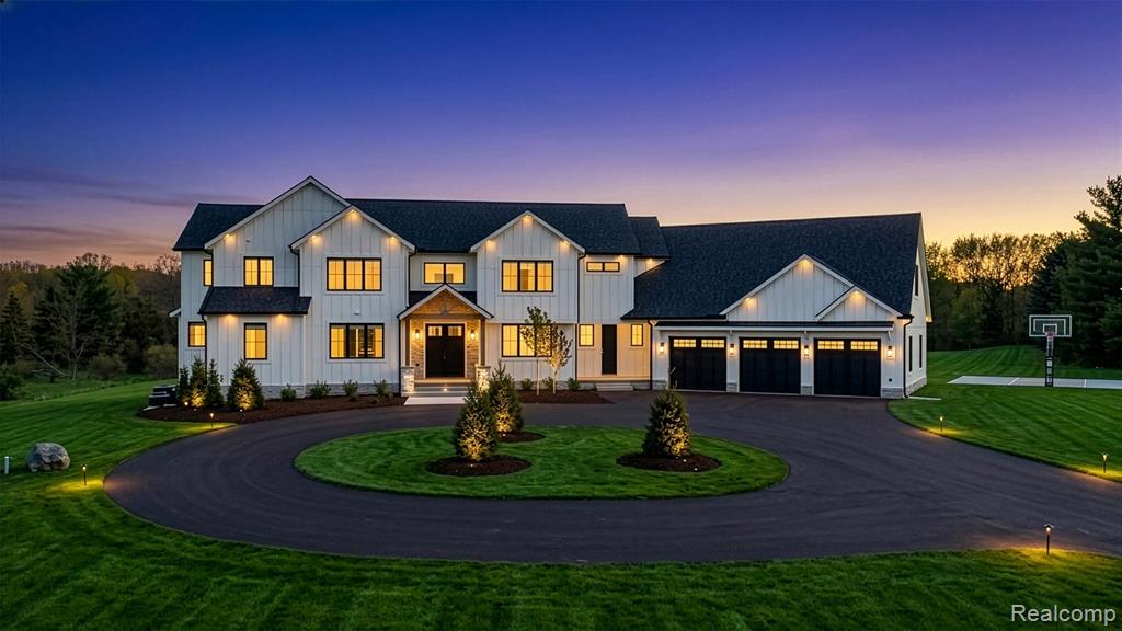 This 2025 modern farmhouse masterpiece is set on 9.9 private, usable acres.  With 6-bedrooms and 5 1/2-bathrooms, this home blends resort style, technology, and rural flexibility in one exceptional property. Soaring ceilings and an open floorplan create a light filled calming flow the moment you step inside. The stylish kitchen with gorgeous 12-foot quartz island sets the stage for family gatherings and entertaining larger groups. Sleek Café matte white with brushed bronze appliances including a 36” gas cooktop with vented hood fan and dual wall ovens. The entry-level primary suite serves as a serene retreat, with a wall of windows and access to the deck. The primary bathroom features spa-caliber elements, with a soaking tub, oversized shower, and refined finishes.  Additional bedroom with full bathroom on entry level.  Flex room, perfect for a home office, gym or kids hang out is located above the garage, with interior access.  Designed for effortless indoor-outdoor living, the 4-season room and primary suite both open onto a huge Trex deck overlooking the expansive grounds. Below, a weather-protected patio leads to a resort-inspired terrace complete with a natural-gas fire table, perfect for year-round entertaining. Beautiful hardscaping and landscaping, supported by sprinkler system.  The acreage supports a dream play structure, a full basketball court, and plenty of flat backyard ideal for adding a future pool, a hobby farm or gardens.  A full daylight, unfinished 2800+SF walk-out basement expands your living and recreation options. Modern comfort is ensured with zoned heating and cooling, two tankless water heaters, all copper plumbing, and extensive blown-in insulation in walls and between floors for both energy efficiency and sound attenuation. Bluetooth-activated speakers, Wi-Fi boosters throughout, and a comprehensive security system including a gated drive provide convenience and peace of mind. With no HOA, this property offers rare freedom and potential.