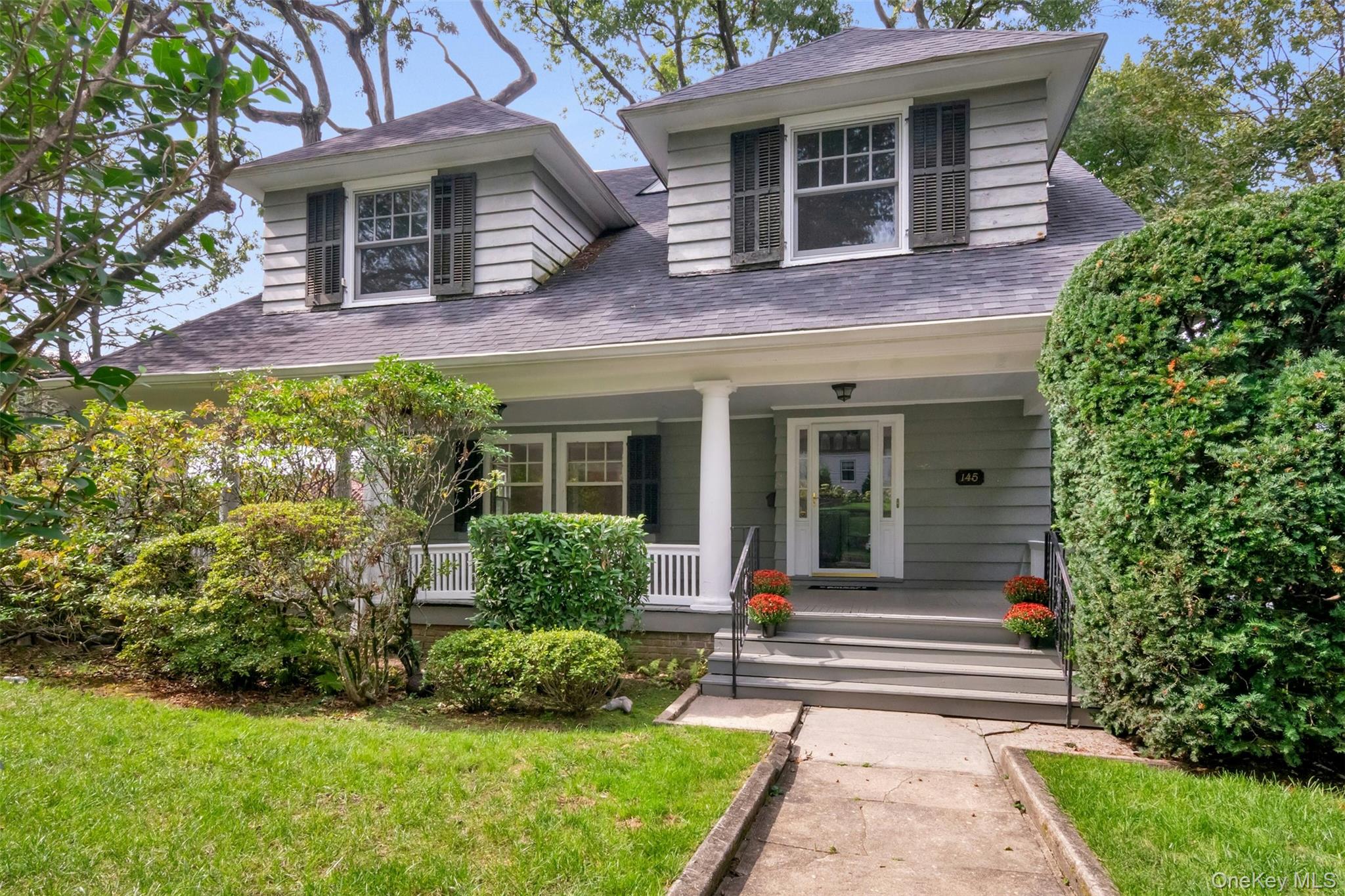 Location, location, location! The cardinal principles of buying real estate have not changed. Nestled in the heart of Pelham Heights on a coveted street, this 1907 3,243 sq. ft. 5 BR, 3 1/2 bath Colonial sits on a 1/4 acre lot with a 2 car detached garage and is a short distance to the Blue Ribbon Colonial Elementary School, state of the art Pelham Middle School, and the award winning Pelham Memorial High School. The Metro North train station is close by (8 minutes), with a 29 minute commute to NYC. Enjoy close proximity to the charming downtown Village of Pelham with shops, restaurants, a movie theater, day care centers, a playground, the Pelham Art Center, a town park with a gazebo and much more! A massive and welcoming front porch is a perfect place to gather, relax and enjoy the open air. A large front foyer leads to generous inviting rooms, with lots of character and period details, including multiple large windows, pocket doors, hardwood flooring, decorative wood moldings and tall ceilings. A luxurious living room with a fireplace, opens directly to an oversized dining room ready for intimate dining and lavish holiday entertaining. A room with skylights was added by the present owners and leads to a large deck with a gas barbecue overlooking a rustic wooded backyard. A primary suite includes a bedroom, multiple closets and an ensuite bathroom. There are 3 additional bedrooms on the 2nd floor, a large hall bathroom and a convenient laundry room. The 3rd floor includes a bedroom (or office), bathroom and storage. A full unfinished basement provides lots of extra storage space. Bring your creative ideas and transform this perfect space on an ideal street into your dream forever home!