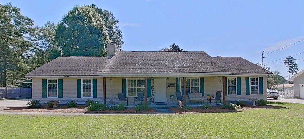 New on the Market!  Discover the space, versatility, and comfort you've been searching for in this spacious 2,700+ square foot ranch-style home, perfectly situated in a well-established neighborhood that offers the peace and quiet of country living while remaining just minutes from the conveniences of town.  The main home features 3 bedrooms and 2 full baths, including a private primary bedroom with an attached bath and two additional bedrooms that share a hall bath. The spacious living and dining areas flow seamlessly to a large screened porch, creating the perfect space for relaxing or entertaining. With stainless steel appliances, engineered hardwood floors,   large laundry room, built in dog kennels,  back screen porch as well as 2 back decks this home is full of well thought out amenities!  A standout feature of this property is the private in-law suite, offering both a separate exterior entrance and access through the main home. Complete with its own living room, bedroom, kitchen, full bath, and private back porch, this flexible space is ideal for extended family, guests, a caregiver, or even a home office.  The former carport has been thoughtfully converted into a large climate-controlled multi-purpose room with finished flooring, providing endless possibilities as a game room, hobby space, home gym, office, or additional family room.  With its generous layout, flexible living spaces, and desirable location, this home is a rare opportunity to enjoy room to grow without sacrificing convenience. Schedule your private showing today!