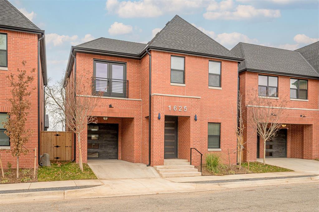 This stunning new construction home, located just blocks from the vibrant Plaza District, perfectly blends modern design with the best of urban living. With the Plaza’s shopping, dining, and entertainment just steps away, convenience is unmatched. The moment you enter, you'll be welcomed by an open floor plan, ideal for both everyday living and entertaining. Neutral tile flooring, crown molding, and custom woodwork add to the home's polished aesthetic. The spacious kitchen is perfect for the cook or entertainer, offering custom cabinetry with inset doors and drawers, a peninsula with a breakfast bar, stainless steel appliances, a coffee or liquor bar with floating shelves, plus a pantry for added storage. Thoughtful details like elegant built-ins greet you at the entry, while a half bath and mudroom bench lead to the attached garage. Upstairs, all three bedrooms and the laundry are conveniently situated for optimal design. The primary suite boasts a vaulted ceiling, spacious walk-in closet, an en suite bathroom with a modern aesthetic that includes a double vanity, elegant lighting, designer wallpaper, and exquisite tile to make your morning routine much more enjoyable. The two additional bedrooms offer flexibility: one is ideal for a home office, and the other serves as a guest suite with the hall bath nearby. The backyard, designed for easy maintenance, includes an open patio, concrete planter box for lush landscaping, and a small grass area. Additional items to note; foam insulated walls, sprinkler system and carport area in front of the garage.