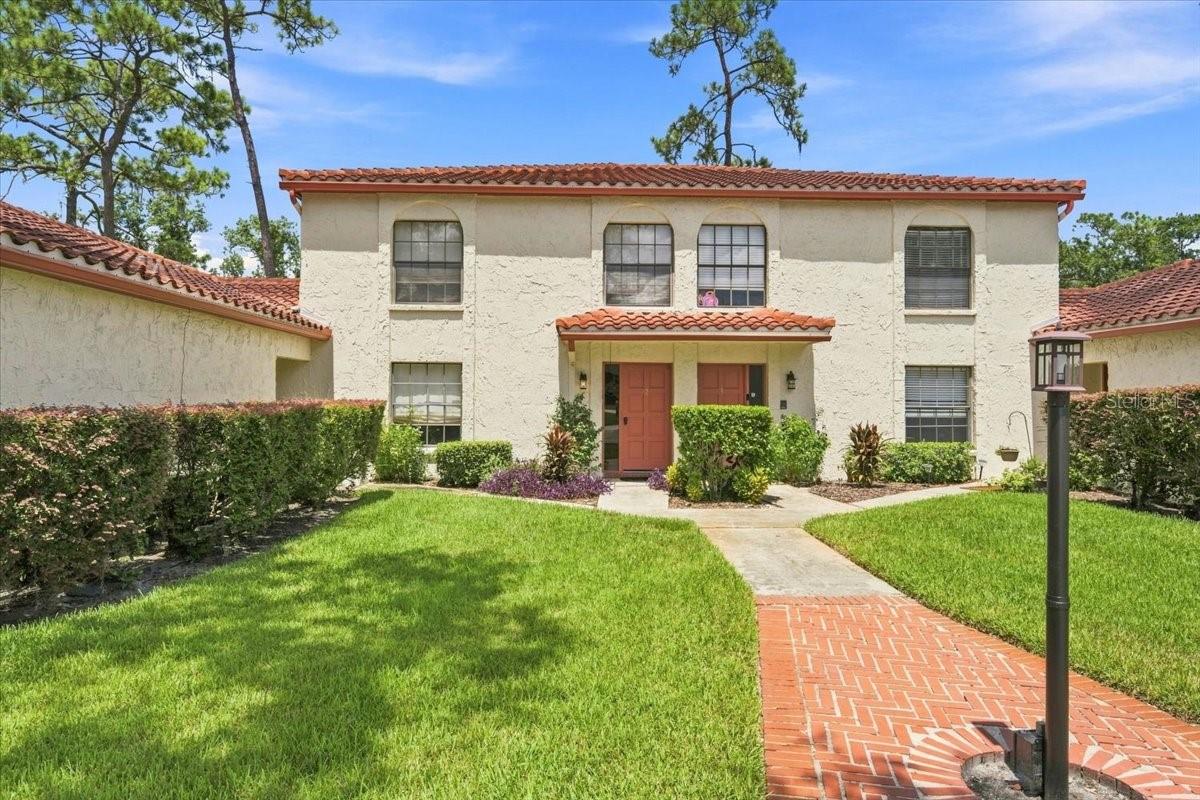 Welcome to easy, resort-style living in the gated community of Saddlebrook. Offered fully furnished and thoughtfully updated, this spacious 3-bedroom, 2.5-bath townhome is tucked against a peaceful conservation backdrop, creating a private retreat in the heart of Wesley Chapel. Inside, an open-concept living and dining area flows into a beautifully renovated kitchen with modern finishes and appliances. Sliding glass doors extend the living space outdoors, while two private back porches offer quiet spots for morning coffee, evening cocktails, or simply taking in the lush surroundings. Upstairs, all three bedrooms provide comfortable separation from the main living areas, including a spacious primary suite with its own private balcony. Updated, spa-inspired bathrooms with walk-in showers complete the home's fresh, elevated feel. In-home laundry, ample living space, and furnishings included with the sale make this an exceptionally turnkey opportunity. Located within Saddlebrook's distinctive golf-cart-friendly setting, residents enjoy 24-hour gated security, beautiful walking areas, and convenient access to the resort's renowned golf, racquet sports, dining, and spa offerings, with certain amenities available separately through the resort. Just minutes from I-75, the home is also convenient to The Shops at Wiregrass, Tampa Premium Outlets, The Grove, AdventHealth, restaurants, entertainment, and everything the rapidly growing Wesley Chapel area has to offer. Whether you're searching for a full-time residence, seasonal Florida escape, or furnished getaway, this is an opportunity to enjoy the relaxed Saddlebrook lifestyle from day one.