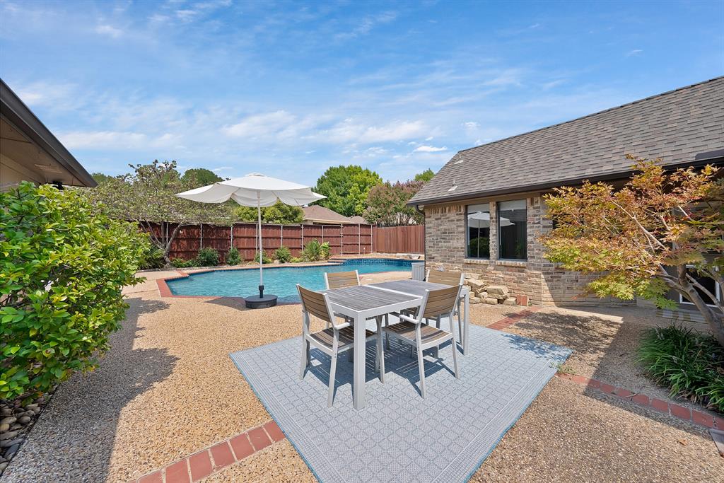 If you're not wanting a new cookie-cutter home on a small lot, you're in luck! Welcome to this beautifully updated 3-bedroom, 3-bathroom home in the sought-after Los Rios neighborhood of Plano with lots of nature nearby and an abundance of mature trees. This home is on an oversized lot and loaded with character! Cathedral ceilings and tray ceilings offer architectural interest and gorgeous hardwood floors and wood molding flow throughout the open layout, offering both warmth and style.  The home features multiple living areas, including an extra space perfect for a game room, homeschool, or private office. The spacious living areas and updated kitchen with custom built-ins, SS appliances and lots of cabinets & natural stone counters are ideal for everyday living and entertaining. The spa-like primary suite provides a relaxing retreat with modern finishes and a serene atmosphere. Step outside to your private backyard oasis, where a covered patio and sparkling resurfaced diving pool sets the stage for summer gatherings and memorable celebrations. With no HOA, you’ll enjoy freedom and flexibility in how you use your property. The home’s fantastic location adds even more appeal, with Dooley Elementary just around the corner and Oak Point Nature Preserve and Bob Woodruff Park nearby, offering a fishing pier, playground, sand volleyball court, and miles of scenic trails. Convenient access to Hwy 75 and George Bush Trnpke makes commuting and exploring the metroplex a breeze. Thoughtfully updated, move-in ready, and ideally located, this home blends comfort, convenience, and lifestyle in one exceptional package. Schedule a showing and make it yours today!