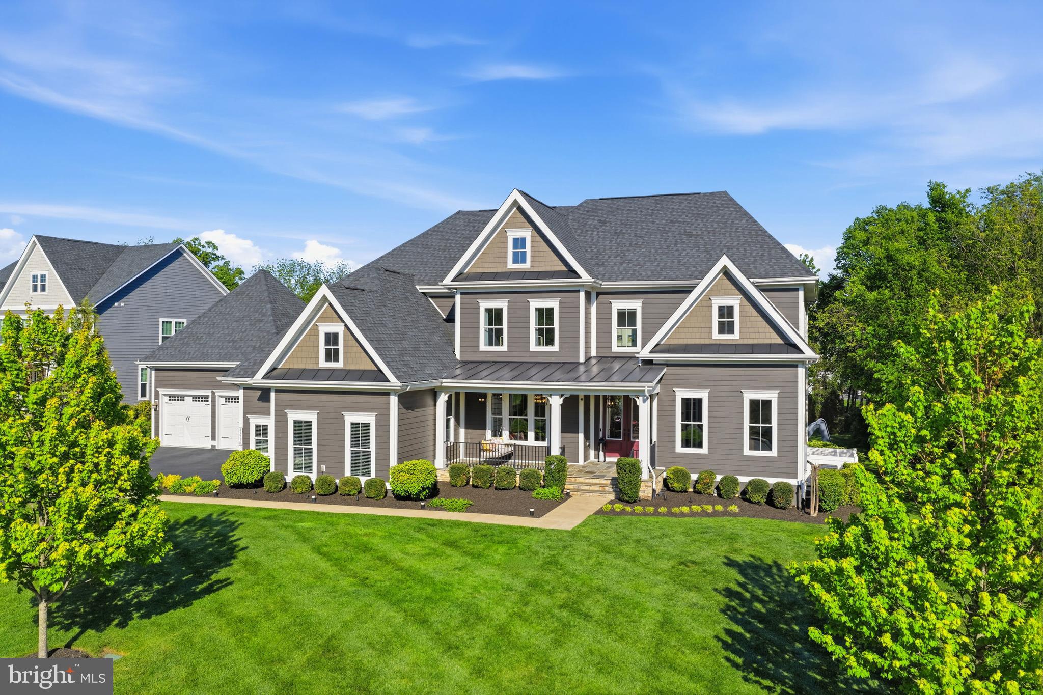 Nestled in the prestigious Willowsford Grant community, this stunning Clifton Park model—one of the most sought-after floor plans in Willowsford—offers over 8,000 square feet of luxurious living space across three impeccably finished levels. Showcasing unparalleled craftsmanship, extensive custom upgrades, and sophisticated designer finishes, this extraordinary residence defines elevated living in one of Northern Virginia’s premier communities.From the moment you enter, you are welcomed by stunning 9-inch wide-plank engineered luxury vinyl flooring installed throughout the home, custom modern chandeliers, premium custom paint, and thoughtfully curated high-end details at every turn. The gourmet kitchen has been completely enhanced with luxurious quartz countertops featuring dramatic 3-inch mitered edge detailing, customized cabinetry and storage solutions, and seamless flow into the breathtaking two-story family room highlighted by a beautifully upgraded fireplace.Designed for both luxury and functionality, the home features a rare main-level in-law suite, custom-built closets throughout, a beautifully renovated powder room, and a fully remodeled spa-inspired queen bathroom with an elegant stand-in shower. Additional custom spaces include a dedicated music room, private gym, and table tennis room, creating a home perfectly tailored for both entertaining and everyday living. A whole-house water softener system and reverse osmosis drinking water system in the kitchen further enhance comfort and convenience.The fully customized walkout basement is a true showpiece, flooded with natural light and designed for exceptional entertainment. This luxurious lower level features high-end flooring, a stunning custom bar and lounge area, renovated private home theater, expansive recreation room with oversized screen and in-wall surround sound system, and beautifully designed entertaining spaces throughout.The exterior living experience rivals a private luxury resort. Step outside to an expansive 22x22 premium deck with staircase access to the spectacular pool area below. The heated saltwater lap pool features in-pool heated hydrotherapy seating with jets, overhanging bar countertop seating, and elegant sheer waterfall features. Additional outdoor highlights include a large sunken lounge area with built-in premium seating, expansive patio with direct basement-level access, and a stunning elevated pergola area designed for resort-style outdoor living and entertaining.Additional premium features include a spacious four-car garage with epoxy-finished and insect-proof sealed garage and utility spaces, full irrigation/sprinkler system, and exceptional indoor-outdoor flow throughout the property.Located in the award-winning Willowsford community in Northern Virginia, residents enjoy access to scenic walking trails, resort-style pools, lakes, fitness centers, parks, community events, and a unique farm-to-table lifestyle surrounded by preserved natural beauty. Conveniently situated near top-rated schools, dining, shopping, and major commuter routes, this exceptional home offers luxury living at its absolute finest.