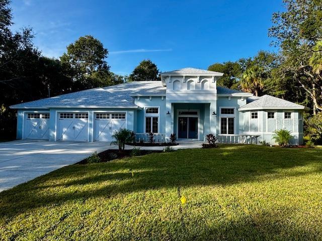 NEW! & MOVE IN READY!! This stunning and NEVER LIVED IN country estate is located in the gated community of the FLAGLER BEACH POLO CLUB, offering the perfect blend of privacy, space and natural beauty. Situated on OVER 1 ACRE, the property BACKS UP TO BULOW CREEK WATERWAY, ideal for adding a private PIER & DOCK for KAYAKING, CANOEING, FISHING & enjoying the water views, wildlife and miraculously tranquil setting.  Across the street, you'll find a SERENE WATER FEATURE W/ FOUNTAIN, enhancing the home's natural setting.  This thoughtfully designed home features 4 bedrooms,(all with walk-in closets) 3 FULL BATHS, Dedicated double door den, and OVERSIZED 3 car garage. Inside you'll find 9'4" ceilings throughout, including the garage along with insulated and reinforced, 8' country styled GARAGE DOORS, extra garage outlets, & attic access stairs for added convenience.  The GOURMET KITCHEN is a true centerpiece, showcasing granite-waterfall countertops, a large island with COOKTOP and CHIMMNEY HOODVENT. Granite surfaces continue throughout all baths and WET BAR area. A LARGE WALK-IN PANTRY & 2 LAUNDRY ROOMS add both luxury and practicality.  Every detail has been elevated, frm 8 FOOT INTERIOR DOORS to PORCELAIN TILED FLRS THROUGHOUT. The dining nook features exquisite MITERED GLASS, while 3 8'H sliders open to a LARGE COVERED LANAI w/ recessed lighting and CEILING FAN, perfect for enjoying your backyard oasis.  The PRIMARY SUITE  offers a SPA-LIKE RETREAT, complete with an AWARD WORTHY BATH, featuring SOAKING TUB seamlessly positioned alongside a BEDROOM SIZED WALK IN SHOWER w/dual entry.  Dual closets, and private laundry space. All interior lighting fixtures and BEDROOM FANS are already installed, making this home truly MOVE-IN READY.  Best of all your on in a country wonderland, just minutes from FLAGLER BEACH, ORMOND BEACH, PALM COAST TOWN CENTER SHOPPING, ST AUG, DAYTONA BEACH ORLANDO AND JAX & much more.  Seeing is believing, BRING YOUR BUYER'S NOW before it is gone.  PRICED RIGHT!!
