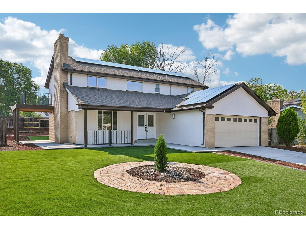 Welcome to this spacious and versatile home in Denver's established Hampden Heights neighborhood, offering updated living spaces, abundant storage, solar power, and a convenient southeast Denver location.Inside, the bright, open layout features attractive wood-look flooring and a generous living area with a wood-burning fireplace. The updated kitchen offers white cabinetry, granite countertops, tile backsplash, stainless steel appliances, modern black fixtures, and ample storage. A second refrigerator adds convenience, while multiple living and dining areas provide flexibility for entertaining, working from home, or everyday living.Upstairs, the spacious primary bedroom features a private porch/balcony-a unique outdoor retreat. Additional bedrooms offer flexibility for guests, offices, or hobbies.The full finished basement adds valuable living space with a second partial kitchen/bar area, extra storage, and flexible bonus space. The home also features the rare convenience of TWO laundry rooms.Major highlights include solar power, a new furnace, new water heater, attached two-car garage, expansive driveway, covered front porch, landscaped yard, and outdoor living space.Enjoy nearby Hampden Heights Park, neighborhood trails, the High Line Canal, Cherry Creek State Park, Kennedy Golf Course, and James A. Bible Park, offering excellent options for walking, biking, golf, and outdoor recreation.Shopping, groceries, restaurants, and services are easily accessible along Hampden Avenue, Havana Street, and Parker Road, with convenient connections to I-225, the Denver Tech Center, and Nine Mile transit.With a finished basement, second kitchen/bar area, two laundry rooms, private primary porch, fireplace, solar power, updated kitchen, new mechanicals, extensive storage, and two-car garage, this Hampden Heights home delivers the space, flexibility, and location buyers are looking for.