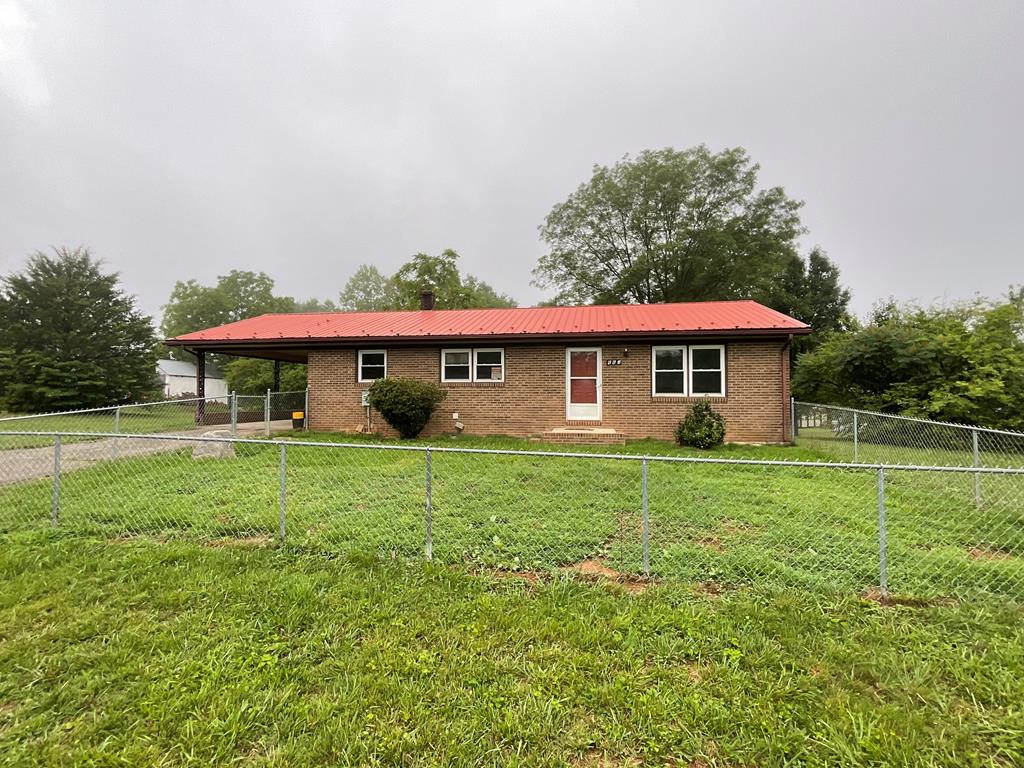 Completely renovated and move-in ready, this well maintained 3-bedroom, 2-bath brick ranch sits on just over an acre in the peaceful countryside of Ararat, VA, offering the perfect blend of country charm and everyday convenience. The bright, welcoming floor plan features a spacious living room, dining area, and an inviting kitchen that's perfect for gathering with family and friends. Recent renovations include luxury vinyl plank flooring throughout, fresh paint throughout, new trim and molding, new dishwasher, updated countertops, some new cabinetry, modern fixtures, and a beautifully refreshed interior. The full basement offers both interior and exterior access and includes a full bathroom, a sink, multiple rooms, and abundant storage. Originally used as living space while the main level was completed, it now provides endless possibilities for recreation, guests, a home office, hobby space, or multi-generational living. Step outside onto the large open deck overlooking the spacious, level backyard with fruit trees and plenty of room for entertaining, gardening, or play. The front yard offers chain-link fencing. A small storage building in back provides extra space for tools and equipment. The paved driveway offers easy access from the main road. Located just minutes from Mount Airy, NC, you'll enjoy convenient access to shopping, restaurants, medical facilities, the Blue Ridge Parkway, local orchards, fruit stands, wineries, and other area attractions. This home has been lovingly maintained and is truly ready for its next owners.