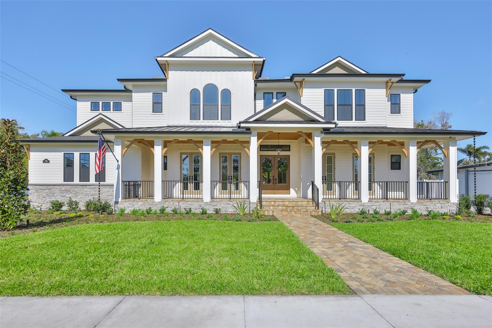 MOVE IN READY- Welcome to 4123 W. Corona Street, a masterpiece of modern living nestled in the heart of South Tampa. This exquisite new construction home combines sophistication and comfort, offering an unparalleled lifestyle in the coveted Mabry, Coleman, and Plant school district on a spacious 12,000 SF lot. As you approach, the home's southern manor charm greets you with elegant French doors and a welcoming covered porch. Step inside and feel the seamless flow of the expansive 5,162 sq ft interior. Sunlight pours through tall windows, illuminating the two-story foyer and inviting you to explore the open, airy spaces. Imagine entertaining in the spacious living areas, where artful touches and luxury finishes create an ambiance of warmth and elegance. The gourmet kitchen is a chef's dream, featuring upscale Fisher & Paykel appliances, double islands, and custom cabinetry. A hidden pantry prep room with a pass-through enhances the kitchen's functionality, while the open flow to the family room?complete with a double-sided gas fireplace?makes it an inviting space for gatherings. The first floor's flexible layout includes a sophisticated study, a dining room with a stunning glass-enclosed wine display, and a cabana room equipped with a full bath and space for a stackable washer/dryer. A mudroom completes the main level, ensuring every detail caters to your modern lifestyle.Ascend to the second level and discover the luxurious primary suite, a true retreat with sound-insulated walls, a spa-like bathroom featuring a soaking tub, and an expansive custom closet. Each of the additional three bedrooms offers its own custom bath and generous closet space, providing comfort and privacy for family and guests. The media room and second-floor laundry room, complete with a dog wash station, add convenience and functionality. Step outside to the breathtaking rear property, where a covered lanai with a stained wood tongue & groove ceiling overlooks the sparkling pool and spa. Imagine savoring your morning coffee here, or hosting barbecues in the summer kitchen as the quiet street hums with peaceful evenings. This home is equipped with top-of-the-line features, including an elevator, whole-home generator, impact windows, and a Moen Smart Leak Detection system. Enjoy peace of mind with in-wall pest tubes, an Elan Smart Home System, and a 2-10 Builder Warranty. With smooth drywall, interior 8ft doors, crown molding, a 25 Seer HVAC system with multi-zoned control, Icynene R-21 spray foam insulation, and speaker pre-wires, every aspect of this home is designed for luxury and efficiency. Imagine living in a home where every detail is crafted for your comfort and enjoyment. At 4123 W. Corona Street, you don't just purchase a home, you embrace a lifestyle. Come experience the harmony of elegance, innovation, and warmth that this exceptional property offers. Make it yours today.