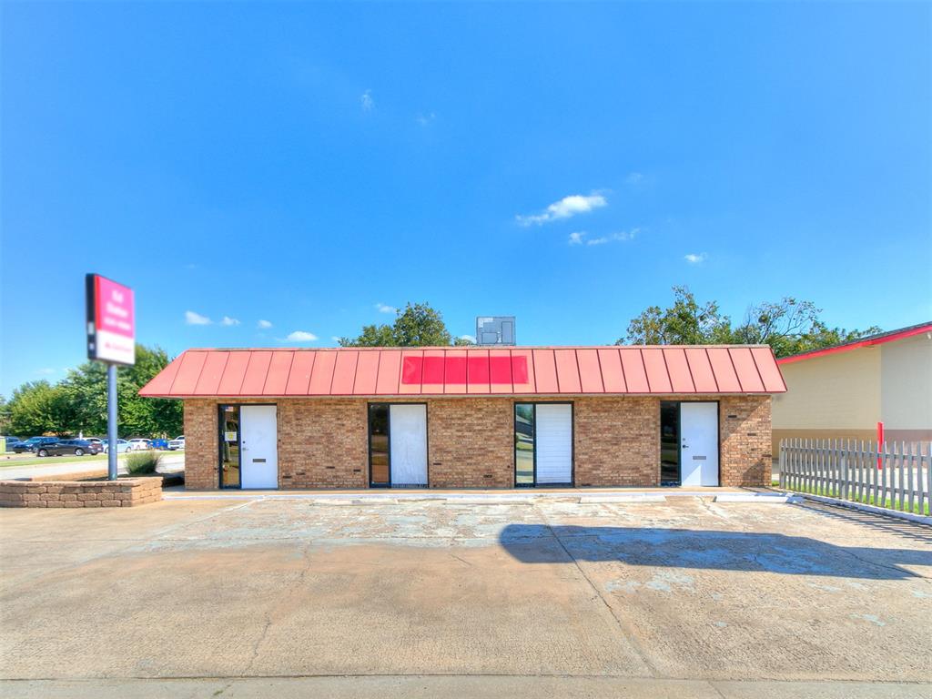 Prime commercial opportunity on a highly visible, busy corner with a stoplight and strong cross traffic. This concrete and steel building offers exceptional flexibility; interior walls can be reconfigured to suit your needs, accommodating a single tenant or up to four. Currently divided into two spaces: a larger suite with multiple offices, reception, storage, and three bathrooms, and a smaller suite with an office, reception, storage, and one bathroom. The building has a durable TPO-style roof installed in 2022 with a 20-year warranty. Approximately 12 parking spaces are available. Excellent location and adaptable layout make this property ideal for a variety of business types or as an investment with rental income potential.
