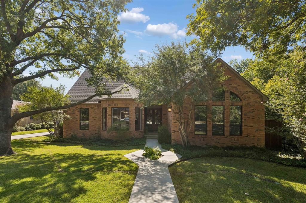 Welcome to this beautifully appointed four-bedroom, three-and-a-half-bath home in the heart of highly sought-after Lake Highlands. Offering more than 3,000 square feet of living space and wonderful curb appeal, this inviting residence combines timeless charm with everyday comfort and versatility. Inside, you'll find beautiful hardwood floors, two fireplaces, and a thoughtfully designed floor plan featuring two spacious living areas, ideal for entertaining, relaxing, or creating a dedicated media space. The updated kitchen features stainless steel appliances, an electric cooktop, and double ovens. An adjoining breakfast area, surrounded by floor-to-ceiling windows, fills the space with natural light while offering picturesque views of the sparkling pool and tree-shaded backyard. A convenient wet bar and separate laundry room add to the home's functionality. The spacious primary suite provides a peaceful retreat, complete with a walk-in closet and an en-suite bath featuring dual vanities, a soaking tub, and a separate walk-in shower. Outdoors, two inviting patio areas overlook the pool, creating the perfect setting for morning coffee, casual gatherings, or entertaining friends and family. Zoned to Moss Haven Elementary, Forest Meadow Middle School, and Lake Highlands High School, this home enjoys an exceptional location in one of East Dallas' most beloved neighborhoods. With convenient access to major highways, medical centers, shopping, and dining, you'll enjoy the best of neighborhood living and city convenience. Discover the warmth, charm, and sense of community that make Lake Highlands such a special place to call home.