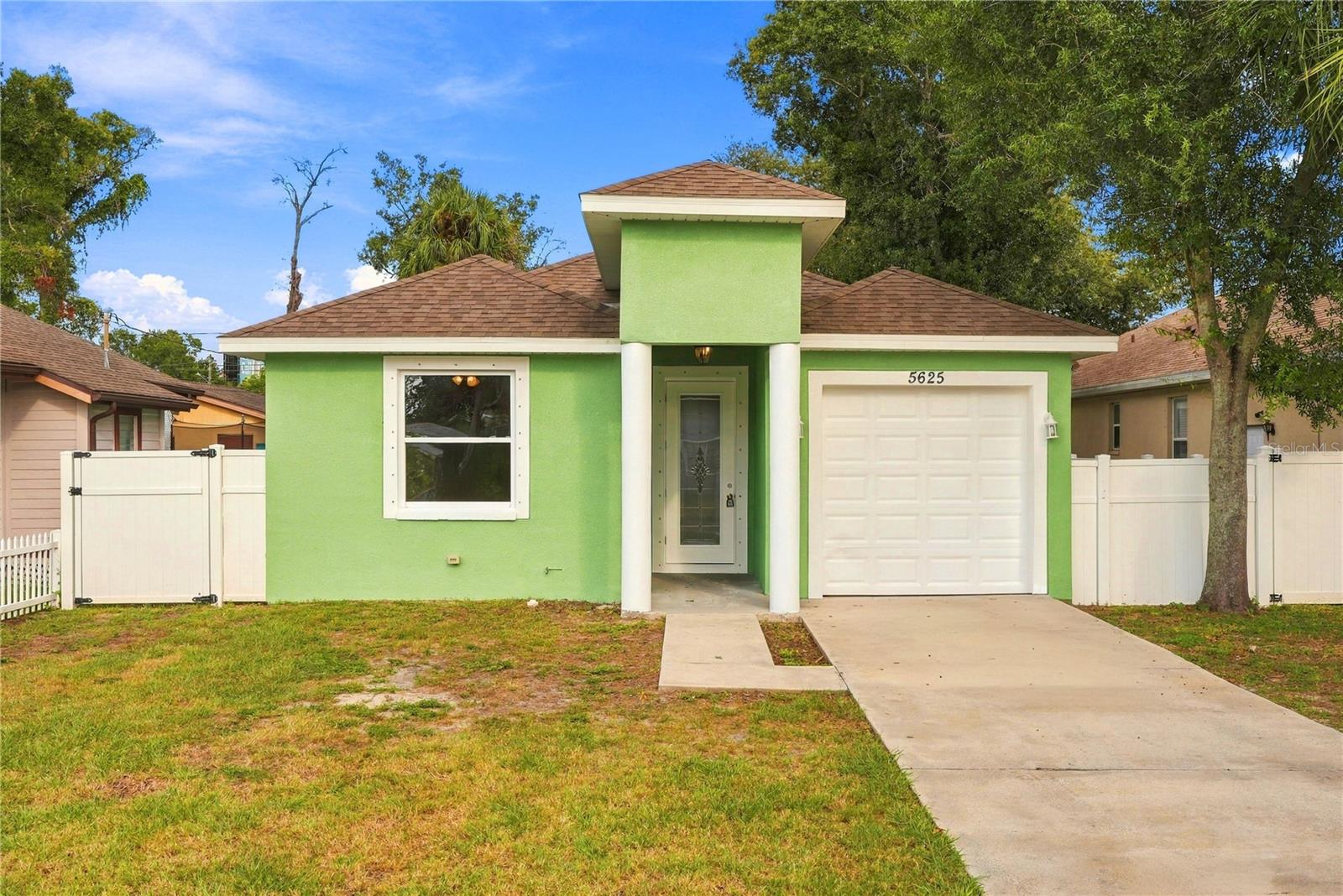 Built in 2020 and beautifully refreshed, this three bedroom, two bath home delivers modern style, thoughtful design and comfortable living from the moment you arrive. Fresh interior and exterior paint creates a crisp, updated presentation, while beautiful flooring flows throughout the home. At the heart of the open living and dining spaces is a custom designed kitchen featuring white shaker cabinetry, granite countertops, stainless steel appliances and a newly replaced electric range. French doors extend the living space outdoors to a covered rear patio overlooking the backyard—an inviting setting for relaxing or entertaining. The spacious primary suite offers a private retreat with two walk-in closets and an ensuite bath featuring dual sinks. Two additional bedrooms provide flexible space for guests, a home office or everyday living, while the generously sized laundry room offers additional room for storage. An attached one car garage completes the functional layout. Conveniently located near shopping, restaurants and everyday amenities, with Downtown St. Petersburg and the Gulf Beaches just a short drive away, this beautifully presented home combines newer construction, stylish finishes and an easy Florida lifestyle.