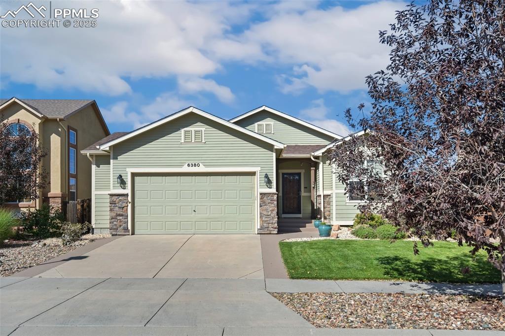 This well maintained Campbell Homes rancher with walk-out basement in Indigo Ranch is bright and welcoming with beautiful wide-plank luxury vinyl that flow throughout the main level and has 9-foot ceilings! Look over the open living & dining rooms from the spacious kitchen, with all stainless steel appliances, a pantry, and a large island. Step out onto the deck & find the perfect place to grill this summer! Roomy main level master includes a raised double vanity, large soaking tub, & cedar wrapped floor in the master walk-in closet. One additional bedroom and full bathroom are on the main level along with the laundry room. The fully finished walk-out basement has a huge 38 x 20 family room featuring a gas fireplace for cozy winters! Two additional bedrooms are in the basement as well as another full bathroom. Large 36 x 10 concrete patio for family gatherings or use the wooden deck for private evenings to watch the sunset. This amazing home also has a 5-star energy efficient rating with PEX manifold plumbing and blown in insulation with 100% encasement. The garage has a 5' extension! Outside, the eye-catching, low maintenance landscaping includes a drip system, automatic sprinklers, a two-tier garden, and a plum tree!  Other notable features includes motion sensor overhead lighting in garage, motion lights on garage and solar lights in front and back, and security cameras front and back. The home is just 5 houses down from one of the many parks this neighborhood offers.