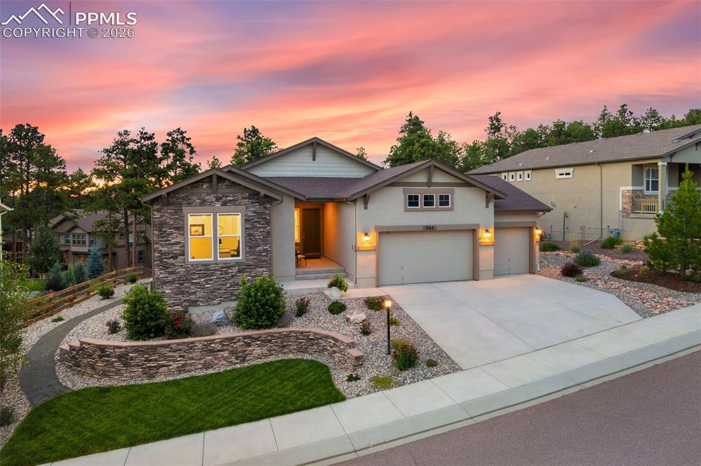 Experience elevated living in this extensively upgraded residence in the prestigious Sanctuary Pointe community; where luxury, comfort, and smart technology seamlessly converge; w/high-end finishes & custom enhancements throughout. The gourmet kitchen is a true showpiece; featuring quartz countertops, a designer backsplash, upgraded sink, premium appliances including a GE Profile refrigerator, & custom cabinetry enhancements with pull-outs, built-in waste system, & elegant lighting accents. A reimagined pantry with tall French doors & added shelving provides both beauty & function. The great room offers a sophisticated yet inviting atmosphere w/a striking stone fireplace, custom mantle, ceiling beams, & built-in cabinetry w/floating shelves. Adjacent dining/flex space includes added cabinetry & updated lighting—perfect for entertaining. Retreat to the luxurious primary suite, complete w/custom wainscoting, ceiling beams, & a professionally designed California Closet system. Spa-inspired baths feature upscale finishes, including an upgraded soaking tub, extended tile work, enhanced countertops, & premium fixtures. The finished lower level is an entertainer’s dream w/a custom wet bar featuring cabinetry, sink, refrigerator, floating shelves, & ambient lighting, complemented by durable luxury vinyl plank flooring. Additional highlights include upgraded carpet & paint throughout, custom window treatments w/Hunter Douglas automated shades, Lutron smart lighting, whole-house humidifier, enhanced laundry & storage spaces, & upgraded garage functionality. Enjoy true smart-home living w/ optional app-controlled lighting, shades, security system, irrigation, & garage access. Existing features include a Ring doorbell, security cameras, CAT6 wiring, & motion-activated exterior lighting.  A rare opportunity to own a meticulously upgraded, turnkey luxury home in Sanctuary Pointe.
