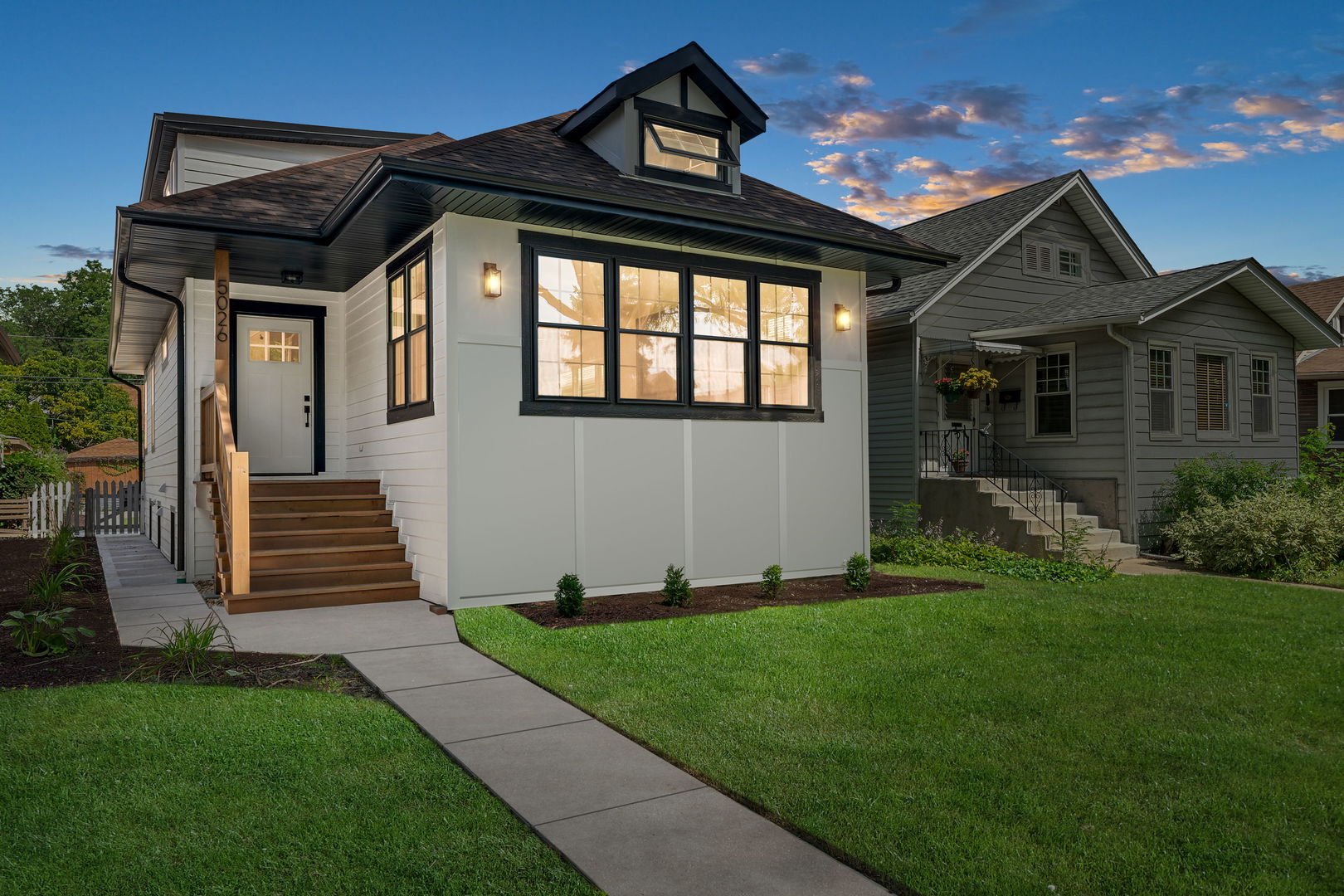 You don't want to miss this gorgeous and affordable, fully rehabbed, 5 bedroom bungalow on a quiet, tree-lined street in desirable Portage Park! Also bordering Jefferson Park, Old Irving Park and Mayfair for a perfect blend of a classic and eclectic Chicago vibe  - amazing, accessible, commuter-friendly location! Walk or short drive to 90/94, Metra and El, vibrant Six-Corners, restaurants, nightlife, schools, Mariano's, Jewel, and Aldi's, services/ amenities, and short drive or bike ride to two amazing parks - Portage and Mayfair parks with pools, bike trails, tennis and pickleball courts and so much more!! FEATURING a modern, open floor plan, new white oak hardwood floors, ventless fireplace, modern sleek, gourmet kitchen with all quartz counters and spacious island, with hood vent, wine cooler, and high end stainless appliances; beautifully upgraded, tasteful baths with radiant heated floors (top 2 floors), and 2nd floor laundry hookup; spacious, fully and newly finished basement with gorgeous new bath, bedroom, separate sitting area/office nook/exercise area, beautiful wood laminate flooring, family room, recreation room and ample closets; laundry/utility room and a large, finished crawl/storage space. ALSO ALL NEW: electrical, HVAC, plumbing with overhead sewer, drain tile AND main city water line, windows, mechanicals, concrete sidewalks, deck and all engineered wood siding. Roof on home and garage approx. 6 years old. A fabulous value - must see!
