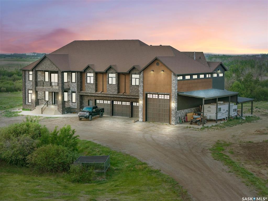 Experience a residence that seamlessly blends modern craftsmanship, timeless design, and exceptional value. Set on 46 private acres in the Rural Municipality of Corman Park No. 344 just minutes from Saskatoon, this extraordinary estate offers over 8,000 square feet of refined living space designed for those who expect more. A significant portion of the home remains in untouched condition. The chef’s kitchen appliances, along with the main and second-floor bathrooms, have never been used — presenting a rare opportunity to own a residence that still feels newly completed.Thoughtfully designed with both luxury and functionality in mind, every detail reflects elevated craftsmanship and purposeful design. Expansive indoor and outdoor living spaces create an atmosphere equally suited for grand entertaining or private retreat living.Property Highlights-6 bedrooms and 7 bathrooms,Turkish spa-inspired primary retreat, featuring a steam shower and dual walk-in closets.Chef’s kitchen with premium Miele appliance package and expansive unused countertops.Private home theatre.Elegant living and dining spaces with pristine finishes throughout.Two expansive covered decks with panoramic prairie views.Executive office wing with private boardroom, ideal for entrepreneurs or professionals working from home,Private self-contained living quarters with kitchenette.8-car garage, RV parking, and a massive shop — ideal for collectors, hobbyists, or tradespeople.Advanced construction featuring SIP panel design, in-floor heating, and high-velocity climate control46 acres of exceptional privacy with convenient access to Saskatoon and the airport.19 Abbey Road is more than a home — it is a private estate designed for legacy living, elevated entertaining, and uncompromising comfort.