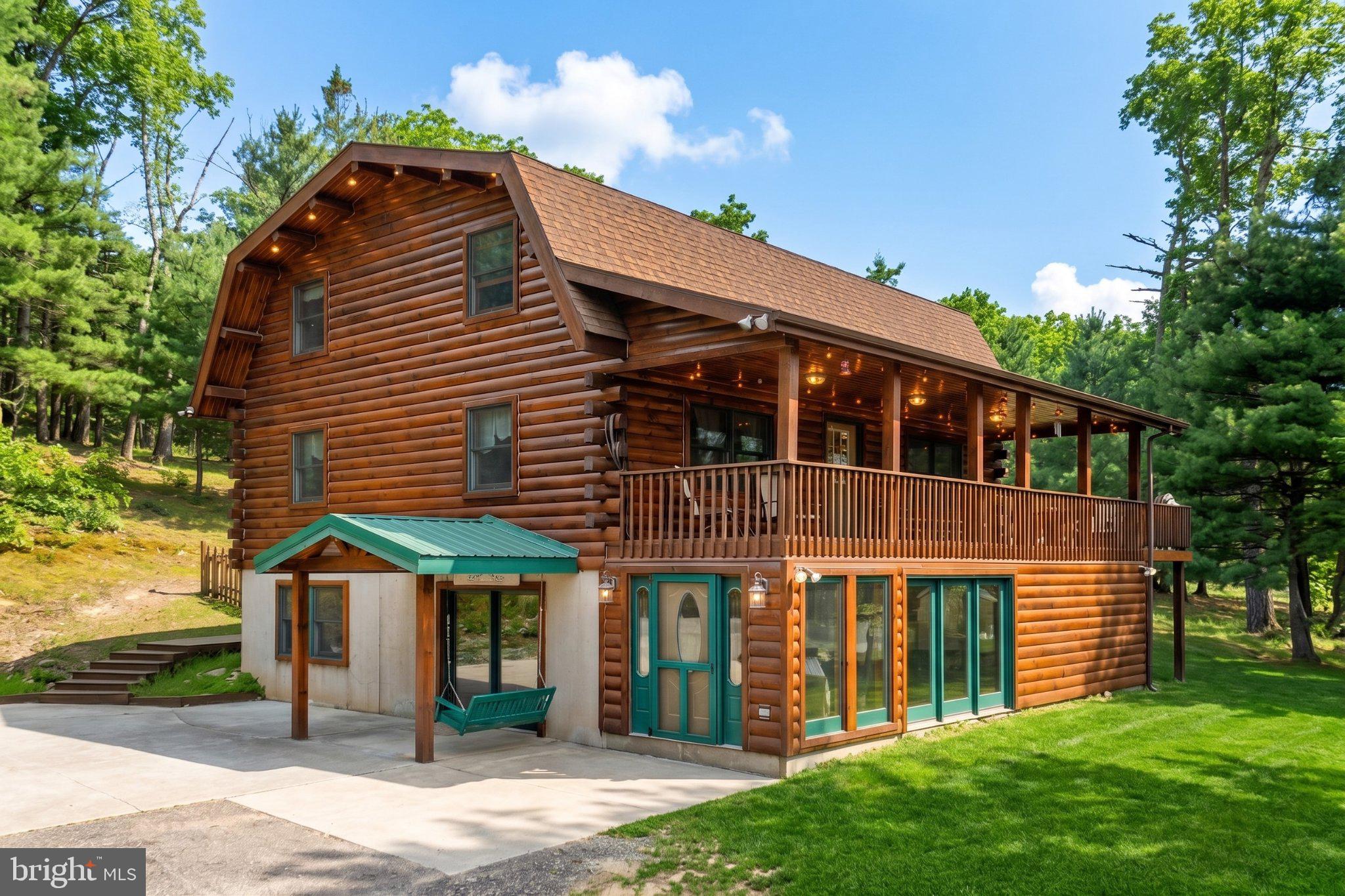 Fantastic location bordering State Game Lands.   Undeniably striking custom log home featuring a beautiful post and beam design with vaulted ceilings, gleaming wood floors, abundant natural light, breakfast nook, and wrap around deck with front/rear covered porches.     Additional heat sources include a coal stove or wood burning fireplace.  The basement offers flexibility for guest quarters, home office, gaming or comfortable additional living space.   Basement was formed with superior walls.  Outside you will find an adorable custom built cottage that perfectly matches the home,  fire pit, picnic area, garden areas, and walking trails.Truly unique living experience!
