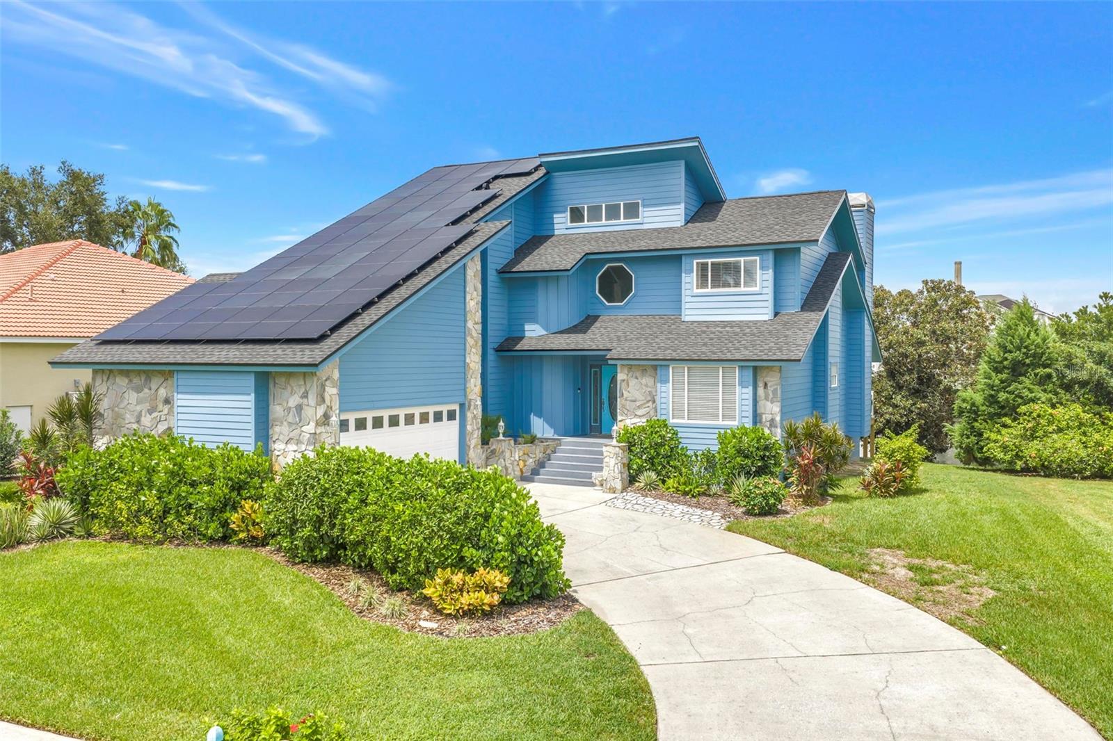 Completely reimagined from top to bottom, this exceptional 4-bedroom, 3-bath residence in the prestigious guard-gated waterfront community of Harbour Watch offers the rare opportunity to own a home where virtually every major system and finish has been updated.Designed for today's lifestyle, the home features a spacious private office with French doors and a fireplace an ideal executive workspace or work-from-home retreat. A first-floor en suite bedroom offers exceptional comfort and privacy for guests or multi-generational living.Soaring ceilings and abundant natural light fill the open living spaces, while expansive windows frame tranquil pond views. Step outside to the beautiful rear deck overlooking the water, where you can unwind, entertain, and enjoy spectacular Florida sunsets in a peaceful setting.Since 2023, the home has undergone an extensive renovation, beginning with a completely remodeled kitchen featuring granite countertops and Samsung stainless steel appliances. The bathrooms have been beautifully remodeled, including a luxurious primary suite completed in 2026 with a spa-inspired walk-in shower and Jacuzzi soaking tub. Additional interior improvements include PEX repiping, a new water heater, whole-house water softener and filtration system, updated lighting, outlets and switches, new bedroom flooring, ceiling fans, barn doors, and a professionally organized primary closet.The impressive list of major upgrades continues with a seller-owned, fully paid 48-panel Enphase solar system (2024), a new roof (2025), upstairs HVAC system with UV light and air purification (2026), Hardie Board siding with new insulation (2024), new soffits (2026), and new sliding glass doors, a kitchen window, and porch (2026). The owned solar system has reduced the sellers' electricity costs by approximately 90%, providing exceptional long-term energy savings with no lease or loan to assume.Harbour Watch residents enjoy resort-style amenities that perfectly complement this coastal lifestyle, including a 24-hour manned gate, elegant clubhouse, Junior Olympic-sized pool, tennis courts, playground, and a community fishing pier with scenic Gulf views.Ideally located in the heart of Tarpon Springs, you're just minutes from the historic Sponge Docks, renowned waterfront restaurants, charming brick-lined streets, year-round festivals celebrating the city's rich Greek heritage, waterfront parks, championship golf, shopping, beautiful Gulf beaches, and Tampa International Airport.