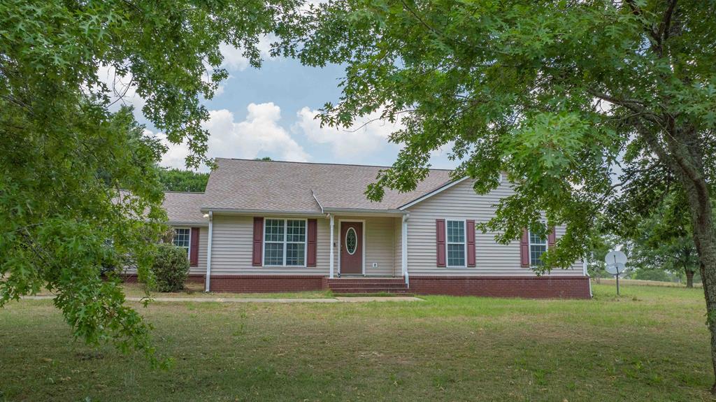 What's not to love in this 4 bed 3 bath home in the country. If you're looking for a home that's off the beaten path, but still close enough to neighbors to borrow an egg, this is it! The living room and dining room are huge, and the fabulous kitchen offers stainless appliances, and large island, a large breakfast nook, and ample sunlight. The bedrooms offer plenty of space and good closets. The primary suite is large, with a walk in closet, and a bathroom with granite counter tops, garden soaking tup, and a separate standing shower. Outside there is plenty of room to stretch out with over an acre of land, and concrete drive, two car garage, and a pond view at the front and field view at the back! Set an appointment to see this gem today!