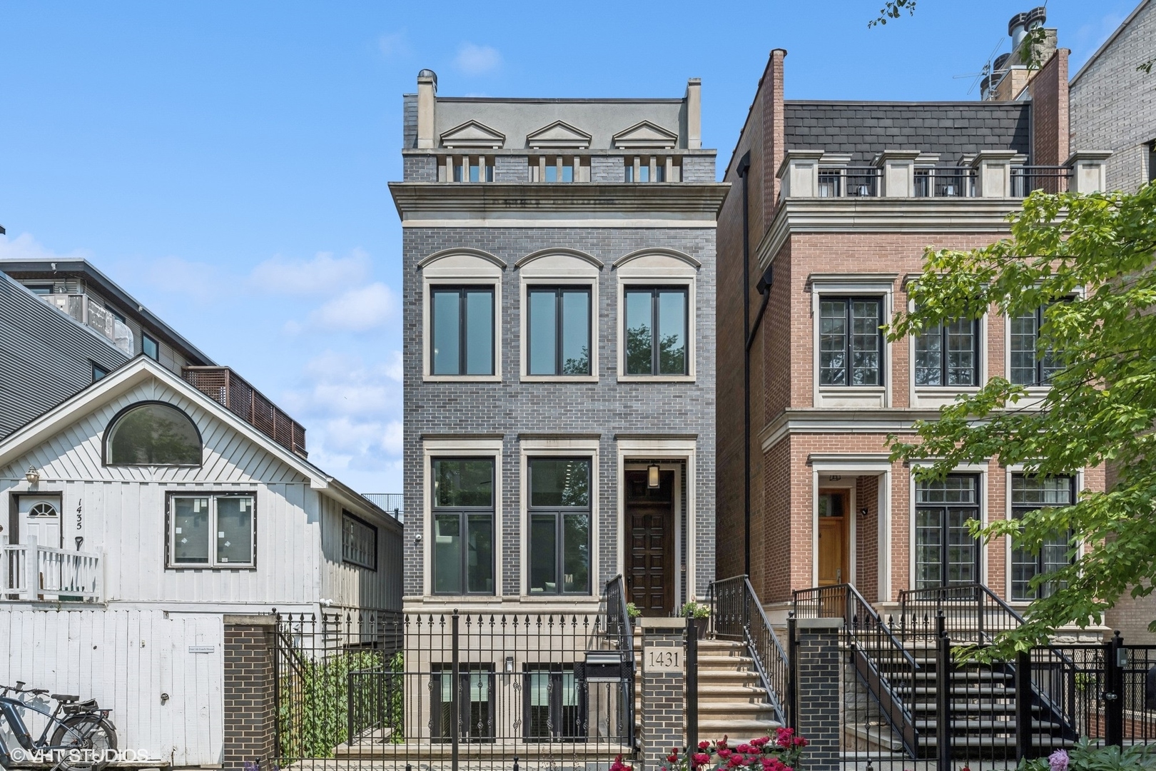 Chic design and contemporary finishes define this unique residence on a peaceful block in the heart of Old Town. Upon entry, you will find yourself in an exquisite two-story living room with large, picture windows, a fireplace, wide 5" oak plank floors, and sleek, white finishes, ushering in an abundance of natural light. The floor plan flows seamlessly into the separate dining area with a large window and ample space to entertain. A conveniently located powder room off kitchen has custom cabinets along with new Kohler toilets, vanity, mirror, and fixtures. An all-new kitchen features a custom waffled ceiling, new Archisesto cabinets, Kohler fixtures, quartz countertops throughout, custom lighting, full size wine cooler, new dishwashers, and a new high-end Miele built in coffee maker for the total coffee lover. Up a couple of stairs, a cozy family room awaits. Sliding doors lead to a back patio, perfect for grilling and direct access to the fully finished garage roof deck complete with pergola, planters, and ample space to dine, relax, and enjoy the sun. A sleek metal staircase leads to the second level, where a lofted office space overlooks the living room alongside a modern chandelier. The primary suite is a peaceful oasis with a spacious bedroom with natural light flowing from two exposures, custom designed walk-in closet, and an ensuite bath with soaking tub, steam shower, double sinks, and marble floors. A second bedroom and full hall bath occupy this floor alongside a laundry closet. The third-floor houses two graciously sized bedrooms with custom closets, brand new ensuite baths, and private terraces. The lower level has a recreation room, gym, large bedroom, full bath with steam shower, and a second laundry room, and a spacious 2-car garage with EV charger. This home is truly turn-key. Welcome home!
