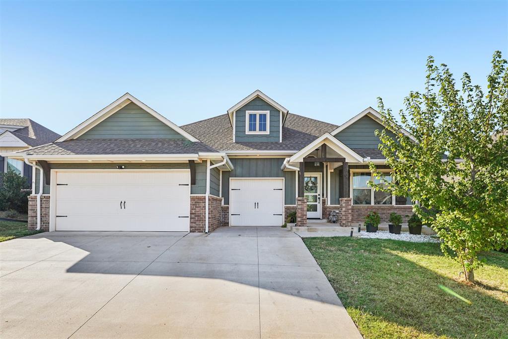 Modern comfort meets timeless charm in Deer Creek Schools! Step inside this stunning 4-bedroom, 2 bath Shiloh floorplan designed for style, function and everyday living. The open concept kitchen features 3 CM quartz countertops, a large island with extra storage, and premium appliances- including a Bosch refrigerator and double ovens that all stay with the home. Gather in the spacious living area under a coffered ceiling with a beautiful stone fireplace or retreat to the primary suite with dual walk-in closets and a luxurious ensuite with separate tub and shower.  Enjoy Oklahoma evenings in your 270 sq. ft. covered outdoor living space complete with a wood burning fireplace perfect for entertaining or relaxing. Located in a vibrant community with resort-style amenities, including a neighborhood pool and recreation facility. This home truly has it all, from a 3-car garage and storm cellar to thoughtful touches like 10-foot ceilings, raised garden bed and a stainless farmhouse sink.