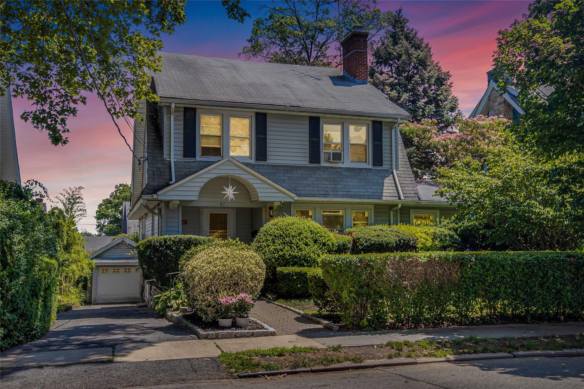 Welcome to a charming true Side Hall Colonial with entrance foyer leading to traditional colonial living. There is a wood burning fireplace in the living room with a adjacent lovely sunfilled office area. You will appreciate the renovated custom EIK with plenty of counter tops and cabinets for pantry storage.  There is a Formal Dining room that can accomidate all for family gatherings. An added convenient feature is half bath off the foyer. The first floor has an additional enclosed four season porch overlooking the backyard with easy access via outside staircase to the lower yard level.  As you climb the staircase to the second floor you will discover a large primary bedroom in adddition to three other large bedrooms. There is a full bath on this second floor level to service the area. Now as you climb the wide staircase to the third level you will find several storage closets and a bonus large bedroom with attached recently renovated full bath.  Lastly we can descend to the lower level of the home to the full finished basement. The basement can be reached via first floor staircase or outside driveway entrance doors. Once in the basement you are met by a large fully finished family room with excellent ceiling height.  A small bedroom with window closet and heat is tucked away in a corner of the basement in addition to a full bath. The laundry room is large and can accomidate two dryers and a washer.  you will be pleased to find a modern Gas boiler that provides heat to the interior of the home. The basement and the first floor enclosed porch have seperate electric heating zones. There is so much to be realized in this home as you add your own individual updates and personal touches. Put on your vision glasses as you explore this New Rochelle gem. Sq/ft is approx. owner wants to hear all offers