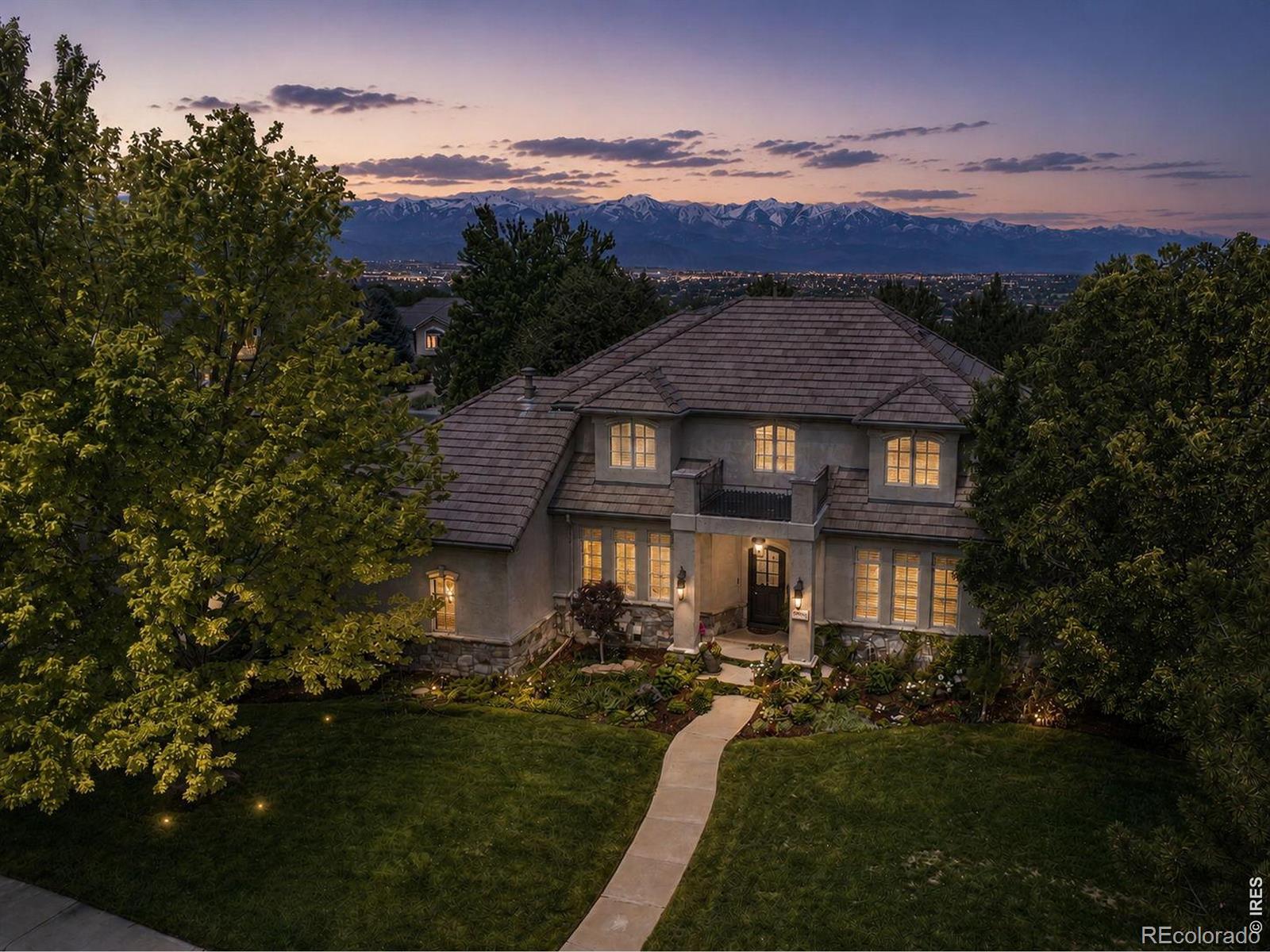 Situated within the exclusive gated Enclave of Legacy Ridge, one of Westminster's premier golf-course communities, this custom home offers over 6,200 SqFt of thoughtfully designed living space. Set on a large corner lot, this residence combines luxury, privacy, & an unmatched lifestyle. The beautifully updated kitchen serves as the heart of the home, featuring custom soft-close cabinetry, quartz countertops, panel-ready refrigerator, Frigidaire appliances, beverage refrigeration, butler's pantry, walk-in pantry, banquet seating w/ storage, oak hardwood flooring, & a fireplace. Cased windows, built-in speakers, & a private courtyard create an inviting atmosphere for entertaining. Throughout the home you'll find oak hardwood flooring, plantation shutters, crown molding, solid-core doors, built-in speakers, Sonos audio, & exceptional timeless millwork. Formal living & dining rooms provide elegant entertaining spaces, while the main-floor primary suite offers hardwood floors, an ensuite office, custom California Closet system, & a stunning spa-inspired bath w/ heated floors. Upstairs are 2 spacious bedrooms w/ new wool carpeting, walk-in closets, window seats w/ storage, connected by a Jack-&-Jill bath w/ separate vanities. An additional bedroom with a private ensuite completes the upstairs. The walkout basement is designed for entertaining w/ a large recreation room featuring surround sound, built-ins, gas fireplace, wet bar, steam shower, 2 additional bedrooms, cedar-lined closet, safe room, & storage. Outdoor amenities include a sport court, covered patio plumbed & wired for a future hot tub, outdoor speakers & security cameras, mature landscaping, newer deck w/ gas line for grilling, & outdoor gathering spaces. Additional highlights include a main-floor laundry room, 3-car garage w/ epoxy floors & built-in storage, newer water heaters/AC units/furnaces, concrete tile roof, & 2 gas fireplaces. You can own one of Legacy Ridge's most distinctive homes.