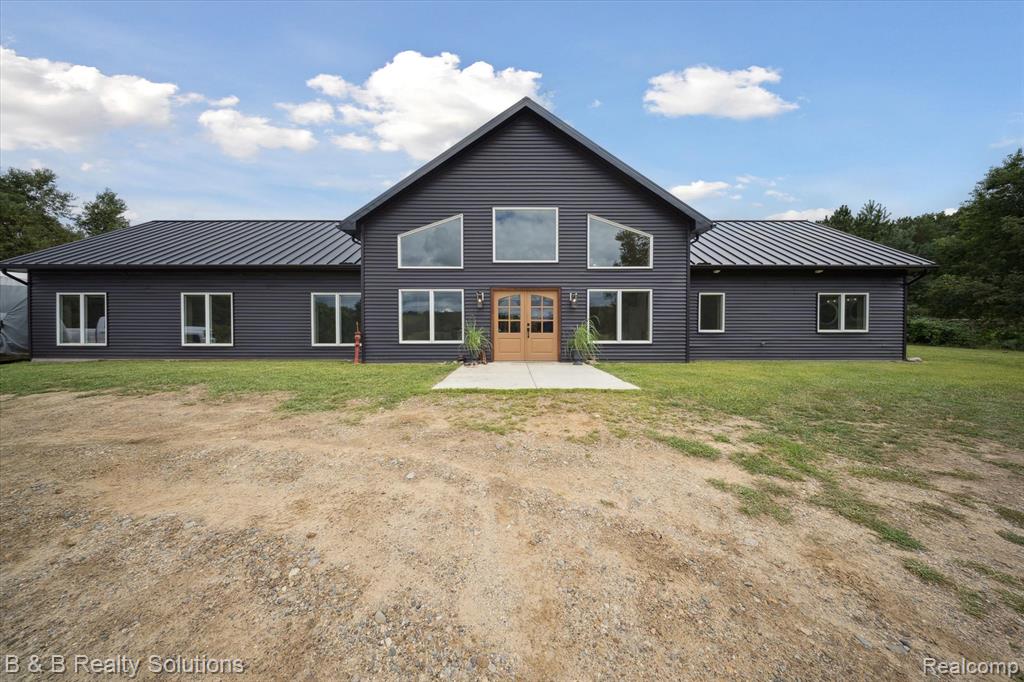 Don’t miss out on this stunning one-of-a-kind home on 40 secluded acres! This property features a main house with 4 spacious bedrooms, 2.5-baths, built in 2022.  Showcasing modern energy-efficient construction with 6-inch ICF walls and in-floor heating. Enjoy an abundance of natural light with high ceilings and large windows throughout.  The open-concept ranch design is perfect for entertaining and family living.  The primary en suite is thoughtfully separated from the other bedrooms, providing a private retreat.  Step outside onto the 30x30 exposed aggregate concrete patio to appreciate natures beauty.   The expansive 1,100-foot private driveway leading to your tranquil retreat with natural gas brought directly to the main house. The property features 200 amp power with fenced pasture ready for cattle or horses.  Great riding trails throughout as well as a healthy population of wildlife, including deer and turkey.  Beautiful rolling hills featuring grass land and mature timber.  Explore the vast opportunities this property presents, from rental income potential or guest houses with 2 additional homes (2 bedrooms, 1 bath and 1 bedroom, 1 bath)  located at the front of the property.  Possibilities of land split for the additional homes.  Located just off a paved road and only four minutes from M-53. 12 minutes to North Branch.   Schedule your private tour today and make this dream property yours!
