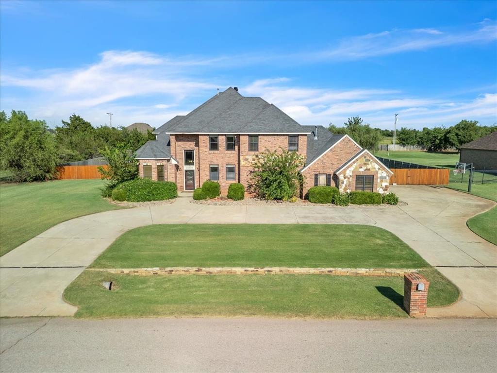 Delightful home offering a blend of style, comfort, and functionality on an acre lot with a pool! This thoughtfully designed home features spacious living areas filled with natural light, an open-concept floor plan, and beautiful finishes throughout. The kitchen is a true centerpiece with sleek countertops, stainless steel appliances, a gas stove, and ample cabinetry—perfect for both everyday living and entertaining. It even has a fireplace off of the breakfast nook with a built-in dinette table. The primary suite is downstairs and it provides a relaxing retreat with a spa-like bathroom, jetted tub, double vanities and a generous walk-in closet. Half bath for guests downstairs. Additional bedrooms and bonus room are upstairs - well-sized and versatile, ideal for everyday living, guests, or a home office. Formal dining and living room with ample natural light. Step outside to enjoy the covered patio and pool area especially with our warm Oklahoma summers. 10 person storm shelter out back. Seller offering $5000 update allowance with acceptable offer. Both are a great spot for gatherings or quiet evenings. This home combines convenience with a sense of community, close to schools, and easy highway access.