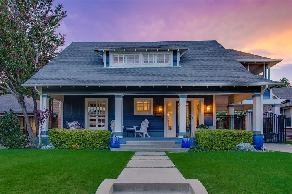 Nestled in the heart of the historic Junius Heights Historic District, this impeccable craftsman blends timeless architectural character with thoughtfully curated modern updates. A welcoming front porch with a classic swing, porte-cochère, gated driveway, and elevated screened porch enhance its charm and functionality. The heart of the home is the expansive chef's kitchen featuring custom cabinetry, quartz countertops, a professional gas range, beverage refrigerator, oversized pantry, and dual sinks. Original period doors and rich millwork blend seamlessly with refined contemporary finishes. The spacious first-floor primary suite features a sitting area, walk-in closet, and updated ensuite bath with dual sinks and a walk-in shower. The light-filled living room with custom built-in shelving sits between the kitchen and formal dining room. A dedicated wine room adds an elegant touch for entertaining, while the adjacent media room with a fireplace could also serve as a fifth bedroom. A striking wallpapered staircase with designer lighting leads to a sun-filled second living area illuminated by skylights and surrounded by stunning woodwork. Three additional bedrooms include one with a built-in desk and another with custom bookcases and direct access to the screened porch. A beautifully updated bathroom completes the second floor. The private backyard is an entertainer's dream with a sparkling pool, hot tub, covered patio, and landscaped gardens. Above the detached one-car garage, the beautifully renovated guest quarters include a full bath and kitchenette, ideal for guests, a home office, or short-term rental. Ideally located just minutes from Lower Greenville, Lakewood, Deep Ellum, White Rock Lake, Knox-Henderson, and miles of trails, this exceptional home offers historic character, modern luxury, and an exceptional East Dallas lifestyle.