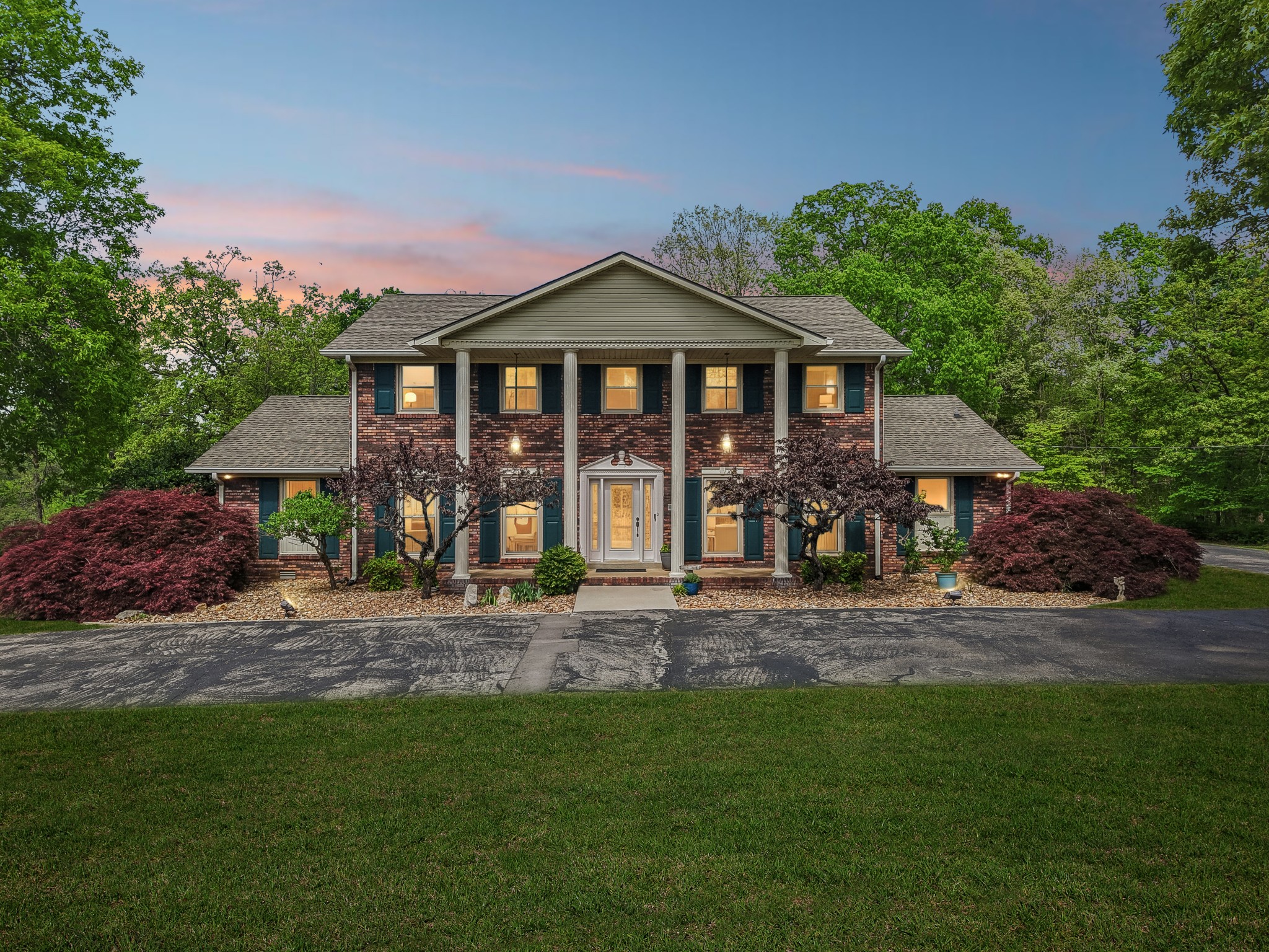 Step in to timeless elegance with this classic Southern Colonial Style Estate, situated on 2.85+/- acres of serene, manicured grounds. This stately 3840 sq ft home boasts 5 generously sized Bedrooms, 3 full Baths, and 2 half-baths. From the home, covered breeze way to A 2-car garage with extra large storage area and garage door openers. Inside, you'll discover refined architectural details, formal living and dining spaces, and rich, classic finishes. The cherry custom cabinets shine throughout the Kitchen area along with the Quartz counter top and built-in desk, large pantry with mobile Island. All appliances are new with Brand New Refrigerator. The Primary Suite is on the main level with new carpet and office area with built-ins ,primary bath w/new shower and walk in closets. 3 of the 4 bedrooms upstairs have their own study desk and built-in bookcases. Beautiful Crown molding through out the house. Great Room for family and entertaining  with remote Gas Log Fireplace. French doors exit to back patio for privacy /entertaining. Laundry facilities include hook ups for Washer and Dryer, along with extra sink, and a half bath, and tankless water heater Seller has replaced all windows in the home, along with interior new paint and exterior paint on the shutters making this home absolutely move in ready. All window treatments convey with the home, along with 2 outbuildings. Contact Us for your Private Showing.