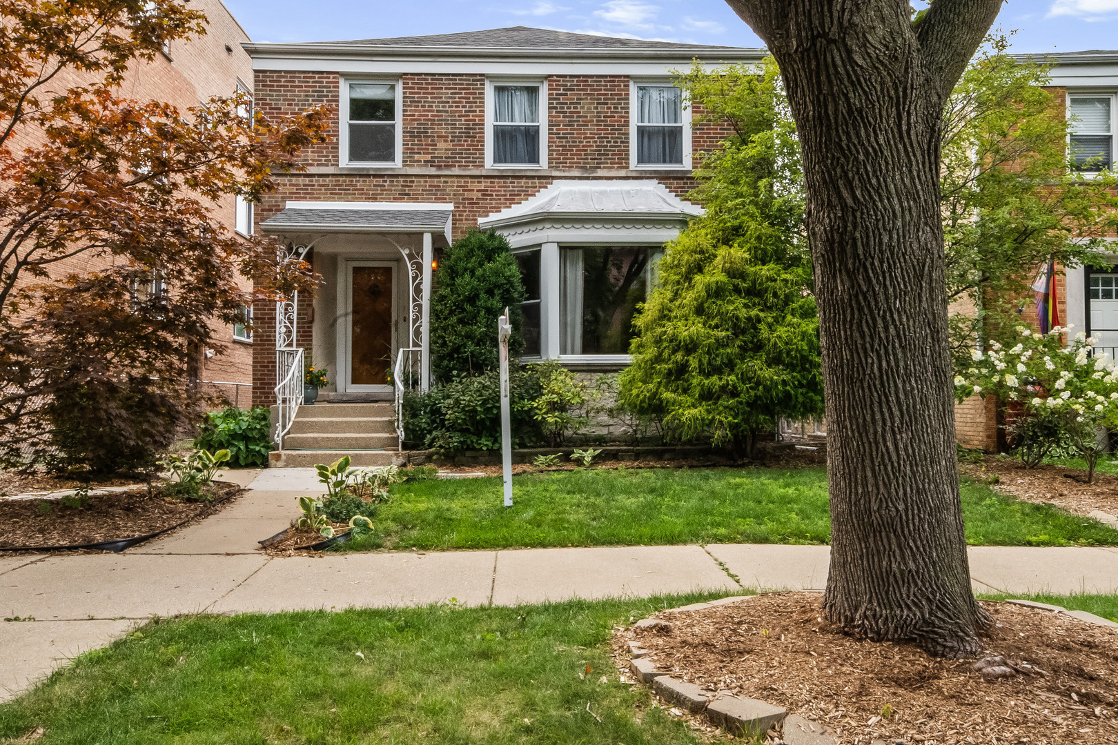 This jumbo Georgian blends classic elegance with modern updates.  Full baths on both upper and lower levels. Main floor includes a powder room and welcoming entryway with coat closet. Huge Living room features cove moldings, bay window, and tall accent windows. Dining room connects to the kitchen and a versatile office/study. Kitchen boasts abundant cabinetry with lower cabinet pull outs, and new Bosch/GE appliances. Spectra convection range with warming spot. The cozy eating area overlooks the extra wide back yard. Refinished maple floors add warmth throughout kitchen and office. First floor opens to a large covered deck with a gas line to the grill in the yard, ideal for entertaining. Upstairs includes 4 bdrms, 3 king sized and a nursery/home office. The rear bdrm opens to a newly built oversized deck. Could be this is your Primary bdrm. Full bath with deep soaker tub, linen closet, and laundry chute. Walk-out basement offers family room, full bath, crafts room with sink/counter/cabinets, separate finished storage area, and laundry/utility space. Direct backyard access adds flexibility and function. There is an oversized 2.5 car garage and a place to park another car. Recent updates: HVAC (2 yrs), roofs and water heater (1 yr). Jamison Elementary is just across the street. Walk to Mather High School. Northside College Prep school is close by as well. Legion Park just a few blocks west and enjoy a stroll the North Shore Canal Trail.