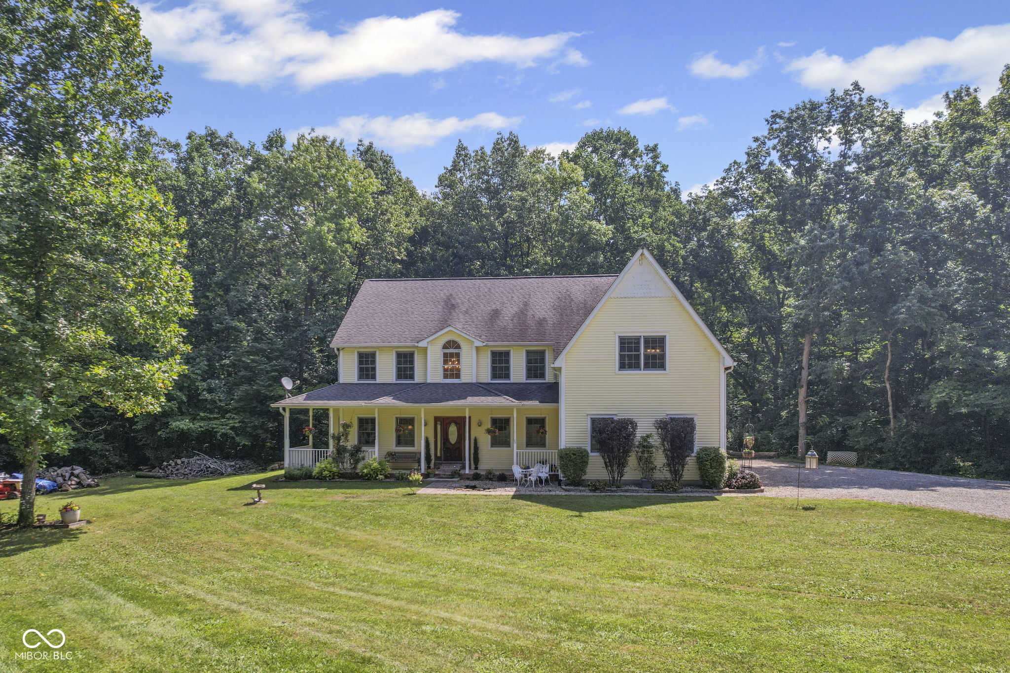 Not just a home, but a retreat-tucked deep down a private gravel road with no through traffic, this 11.66-acre property offers peace, privacy, and a lifestyle where modern comfort meets the beauty of nature. Surrounded by wooded acreage rich with deer, turkey, and other wildlife, it's perfect for those who value seclusion and space to explore. A peaceful creek winds through the land, while trails meander through the woods-ideal for quiet walks, wildlife watching, or simply enjoying the stillness. With room to roam, space for animals, and endless outdoor opportunities, this property delivers a rare balance of natural beauty and modern living. The fully remodeled 5-bedroom, 5-bath home offers over 4,800 square feet of thoughtfully designed living space. The primary suite features a private sitting room, two large walk-in closets plus an additional closet, and a spa-like bath with custom tile shower, freestanding soaking tub, double vanity, and bidet. Four additional bedrooms and two fully remodeled baths complete the upper level. The main floor includes an open-concept layout with a dream kitchen boasting a 10' x 3.6' island with butcher block and vegetable sink, farm sink, walk-in pantry, stainless steel appliances, touchless faucets, and designer lighting. Hardwood and luxury vinyl plank flooring extend throughout. Additional amenities include a finished side-load 3-car garage, three 50-gallon water heaters, dual 200-amp panels, and high-speed fiber internet. The 46x12 deck is ideal for entertaining, while the walk-out basement offers a large family room, remodeled half-bath with plumbing for a full bath, and two flexible rooms for a home office, gym, or creative space. Freshly drywalled and painted, the basement adds versatility. An energy-efficient geothermal system installed in 2020 completes this exceptional property. This one-of-a-kind retreat blends privacy, natural beauty, and modern comfort-don't miss your chance to experience it.