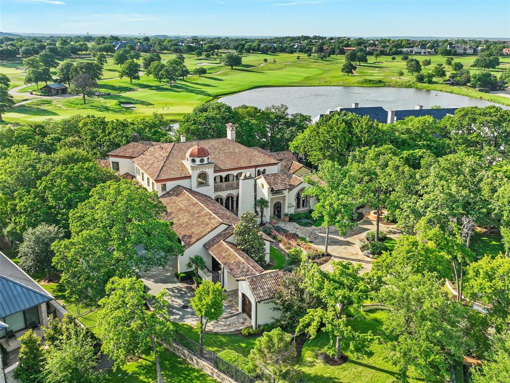 WOW! Nestled within the coveted Private Enclave of Gated and Guarded community of Vaquero in Westlake, thisextraordinary Estate is a RARE opportunity to own one of Westlake's MOST Breathtaking properties. Situated on asprawling 1.6+acre Homesite, this exclusive residence offers unmatched privacy, serenity & spectacular Viewsoverlooking a tranquil Pond & the picturesque 15th Hole of Vaquero’s Championship Golf course+ a priority spot on the waitlist for a golf membership. Enter the private gate into the motor court, you are greeted to a private Courtyard featuring timeless Architecture &impeccable Craftsmanship. Rich in character & elegance & adorned with the highest quality Finishes throughout, thishome reflects refined taste & sophisticated design. Features include flanking French doors from front to back wBreathtaking VIEWS, intricate Marble inlaid floors, Wood flooring, Venetian plaster, custom wood planked Ceilings andextravagant Cast Stone fireplaces. Master Retreat boasts custom finishes w Bay Windows, customCast Stone fp, Wet Bar, marble flooring & countertops w Antique Mirrors + 2 sep closets. The 1st flr is equippedw 2 elaborate finished Studies, 2 Powder Baths, sub-grade Wine Cellar, Chef's Kitchen + Keeping Room, Elevator +spacious Laundry. Upstairs has 2 lrg private Bed Suites, Game-Media, Exercise and lrg Balcony Patio w unmatchedViews. Attached to the home is a beautifully-detailed private Guest Quarters w bdrm, sitting area, kitchenette +laundry. 4 car + golf cart garage. Backyard of your dreams with outdoor Din-Liv, FP, Pizza Oven, Spa, Fire pit, PuttingGreen & tons of trees. This estate seamlessly blends indoor & outdoor Liv & expansive spaces designed for bothgrand Entertaining & intimate everyday moments. Enjoy Sunsets from the patio, relax by the Pond or take in the lushGolf course scenery. Every corner of this property offers a sense of peace & elevated living in one ofthe most Prestigious communities in Texas.