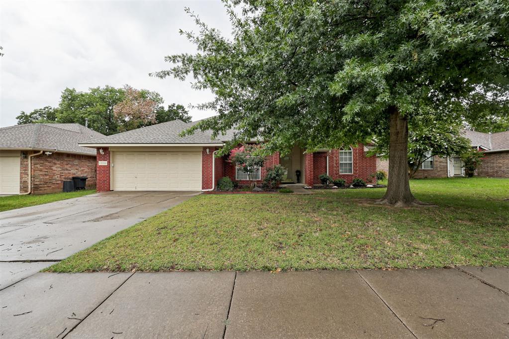 Situated on a quiet street less than a mile from the University of Oklahoma, this move-in ready home offers 3 bedrooms, 2 bathrooms, and a beautiful sunroom. The thoughtfully designed floor plan features a spacious living room with a fireplace that opens to an additional living area, perfect for a formal dining room or sitting area. The kitchen has been updated with luxury vinyl plank flooring, white cabinetry, and stainless steel appliances. The split floor plan provides privacy for the primary suite, which features an en-suite bathroom with double vanities, a tub, a separate shower, and a large walk-in closet. The secondary bedrooms are located on the opposite side of the home and share a full bathroom. Just off the kitchen is a spacious sunroom with heat and air, as well as brand-new luxury vinyl plank flooring. Although the sunroom is not included in the home's square footage, it provides an excellent additional living and gathering space. Additional updates include a new HVAC system (2025), a new roof (2022), and fresh interior and exterior paint.Washer, Dryer and Refrigerator can remain with acceptable offer.