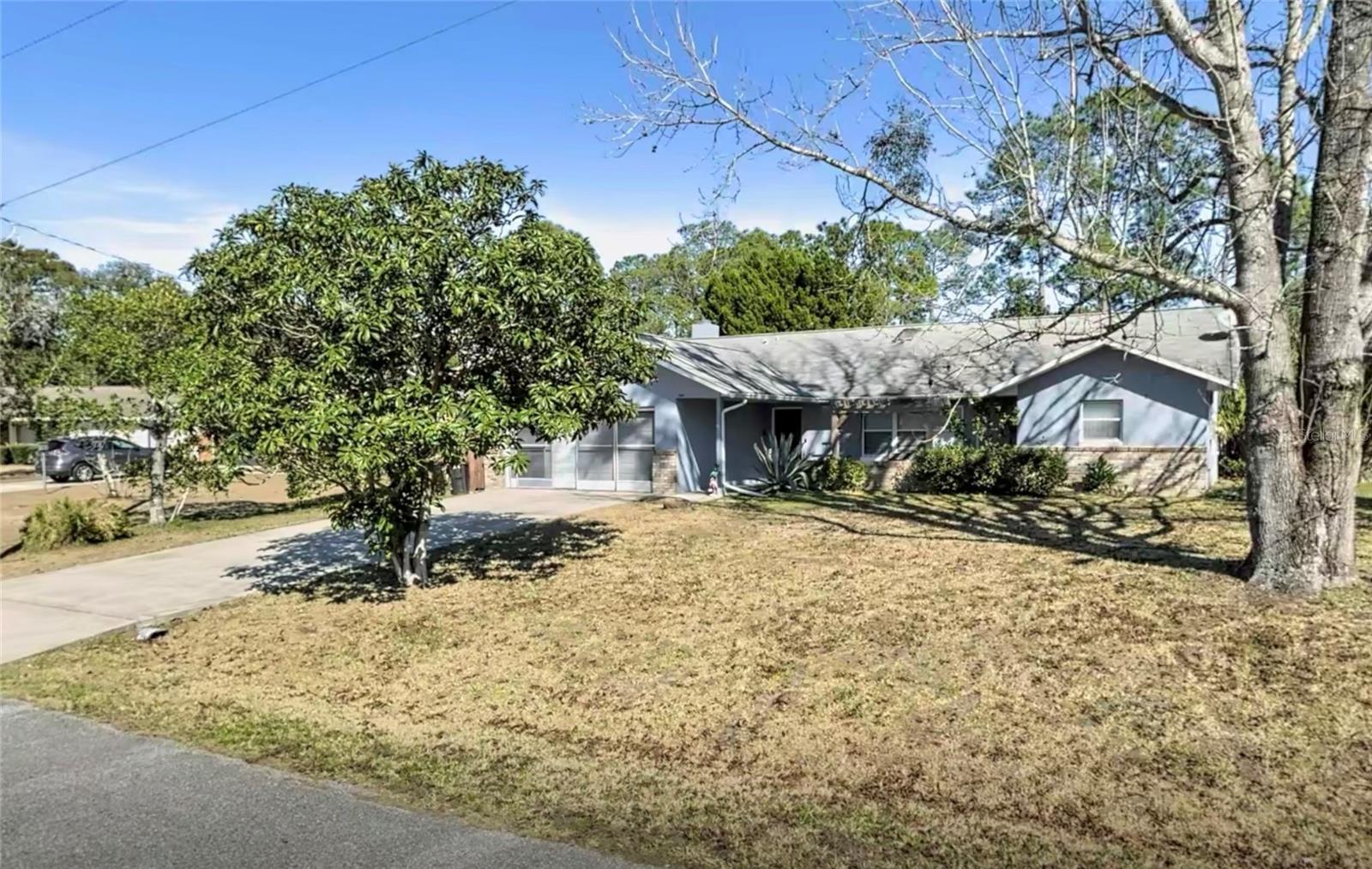 Discover Florida waterfront living in this beautifully maintained fully furnished 4-bedroom, 2-bath pool home on a peaceful freshwater canal. Currently operating as a successful Airbnb, this turnkey property is ideal as a primary residence, vacation retreat, or income-producing investment. The inviting floor plan features an updated kitchen with wood cabinetry, stainless steel appliances, a pantry, and a cozy family room with a wood-burning fireplace. The spacious primary suite offers a walk-in closet, updated walk-in shower, and private access to the screened lanai and pool.Step outside to enjoy your own backyard oasis featuring a screened pool, oversized covered lanai, and tranquil freshwater canal—perfect for fishing, kayaking, entertaining, or simply relaxing while enjoying the peaceful water views. Additional highlights include a shed for storage, plus major updates for peace of mind including a NEW ROOF (2026), HVAC (2017), water heater (2018), and windows (2014). With no HOA, and all interior and patio furnishings included, this truly move-in-ready home offers the perfect blend of comfort, lifestyle, and investment potential.