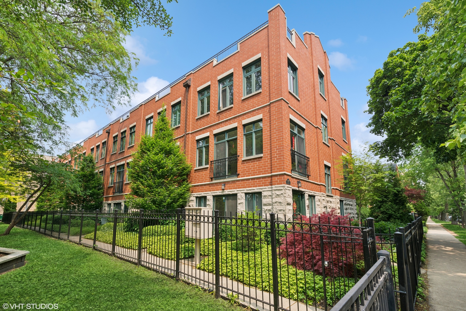 Enormous Hyde Park Townhome with 2400 interior SF, additional three outdoor spaces and two car plus garage. Overlooking gorgeous Stout Park literally outside your front door. Entry level is a big rec room, outdoor patio, generous closet space and wet bar hook-up along with direct access to your 2 car plus garage.  On the main living level, views of the park greenery greet you from your living room.  Beautiful gas starter/wood burning fireplace and built-in bookcases complete the room. Dining area that seats your largest dinner parties. Kitchen with tons of cabinets, spacious countertops, 2022/23 appliances, and large eat-in space.  A convenient balcony off the kitchen is perfect for grilling. All served by a convenient half bath. Upstairs, the perfect king-sized primary suite with walk-in closet.  The en suite bath has dual vanity, soaking tub, and over-sized shower.  Two additional bedrooms are perfect for family or office. Big family bathroom. Convenient 2022 washer/dryer on the bedroom level too. The fourth level houses access to both a north and new south roof deck with scenic park views.  Recent improvements to the complex include partial main replacement, partial roof replacements and repairs, tuckpointing of brick facades and sealing of block facades. Close to the University, Green Line and Metra. Renter friendly.