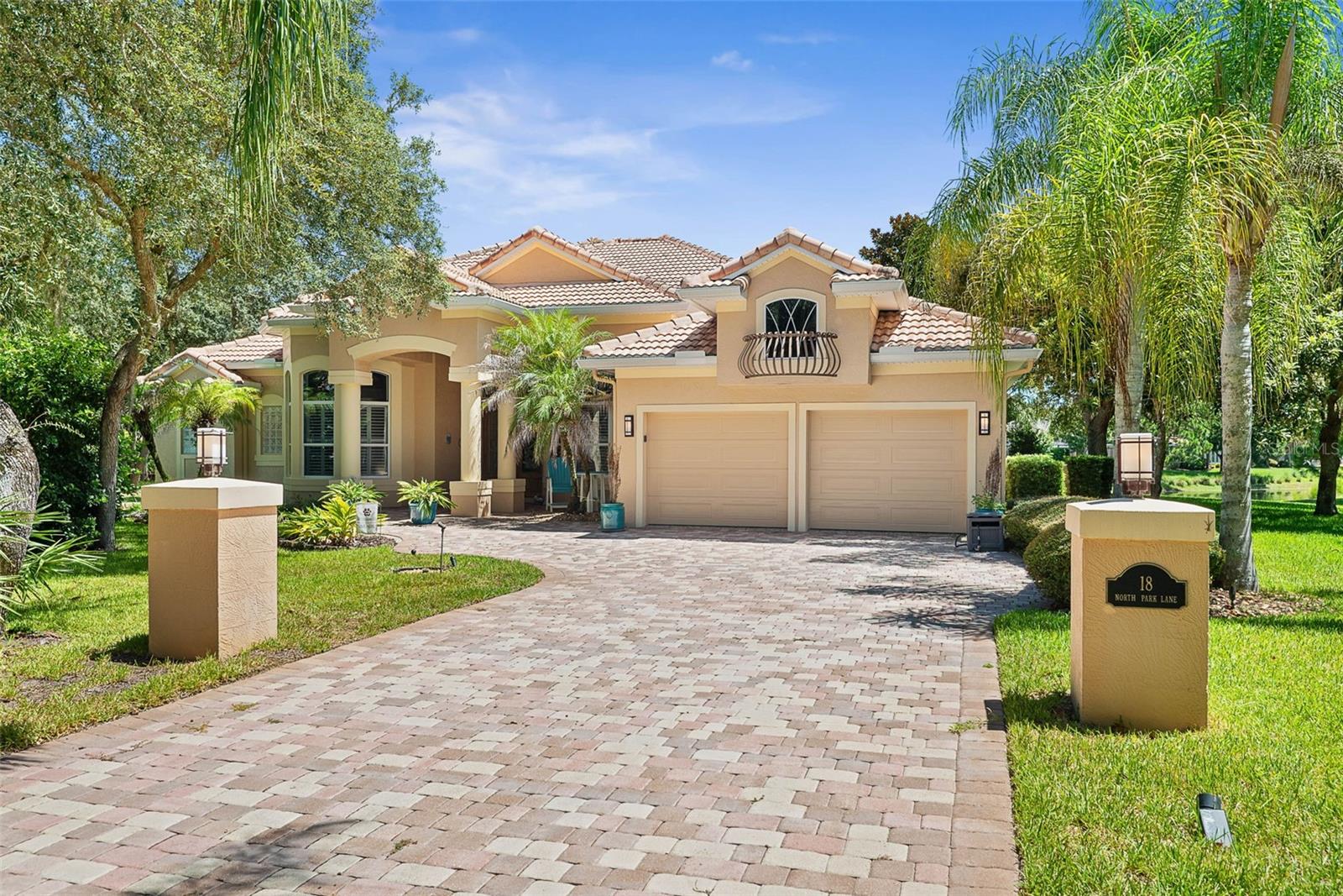Arrive at the end of a quiet cul-de-sac and follow the extended paver driveway to this distinctive 3,804-square-foot pool home in the gated Grand Haven community of Palm Coast. Set well back from the sidewalk on an approximately 0.45-acre homesite, the property offers abundant off-street parking and a sense of privacy created by its generous setback and mature landscaping in both the front and rear. A tile roof and patterned stucco exterior complete the home’s recognizable Florida architecture.Inside, the layout is designed to support both everyday living and larger gatherings. The main level includes formal living and dining spaces, a spacious family room, and an open chef’s kitchen with a large island, two sinks, two disposals, a propane Fisher & Paykel cooktop, and an updated exhaust hood and vent. Ceramic tile flooring throughout the ground level and a coastal-inspired interior color palette contribute to the home’s relaxed Florida character.The living experience continues onto the expansive two-story screened lanai, where the pool, ceiling fans, generous outdoor seating areas, mature landscaping, and lake views create a private setting for morning coffee, afternoon swimming, and evenings outdoors. With a direct connection to the kitchen and family room, the lanai provides substantial space for entertaining. Cape Canaveral space launches can also be viewed from the backyard and lanai, adding a memorable element to life at this home.The flexible floor plan offers three bedrooms, three full bathrooms, and a dedicated office that may accommodate additional sleeping or flex-space needs. Upstairs, a large media room with its own full bathroom provides separation for recreation, guests, or extended stays. Additional features include a sauna with a cedar door replaced in 2025 and a two-car garage with tile flooring.Major improvements include ground-level ceramic tile, interior paint, lighted ceiling fans, the propane cooktop, exhaust hood and vent, complete lanai rescreening, and a high-efficiency pool heat pump in 2021. High-end, high-efficiency HVAC systems serving both levels were installed in January 2023. The dryer was replaced in 2023, the washer and water heater in 2025, and the pool pump in 2026.Located near the Intracoastal Waterway in Grand Haven, one of Palm Coast’s gated communities, this home offers convenient access to an extensive collection of recreational and social amenities. Grand Haven features two pools and spas, two fitness centers, tennis, pickleball, bocce, basketball and croquet, along with a Village Center offering dining, fitness classes and scheduled activities. Miles of walking and biking trails wind through preserve areas and along the picturesque Esplanade coquina trail bordering more than a mile of the Intracoastal Waterway. A privately owned 18-hole golf course is also located within the community, with golf membership available separately. Combined with the home’s approximately 0.45-acre private cul-de-sac lot, long lake views, expansive pool and lanai, flexible interior and system updates, the setting offers a rare balance of privacy at home and access to some of Palm Coast’s most desirable community amenities.