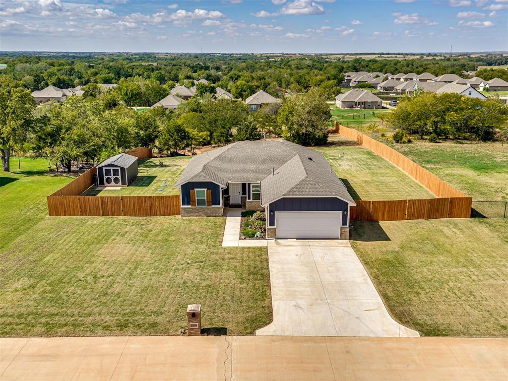 BETTER THAN NEW on .75 ACRE in the award-winning Deer Creek School District! Only 2 years old with approximately $15,000 in improvements already done, including NEW exterior paint, NEW fencing, beautiful landscaping and more! This home stands out from the minute you pull up with amazing curb appeal, mature trees and GORGEOUS sunset views from the backyard! The partially wooded, manicured .75-acre lot gives you so much room to enjoy, plus a storage shed and plenty of space for a future shop or outbuilding. Inside, you’ll love the open floor plan, large windows and tons of natural light. The kitchen features quartz countertops, stainless steel appliances, a gas stove, large island and lots of cabinet space for storage. The primary suite features double vanities and and TWO walk-in closets, one that connects directly to the laundry room! Outside, enjoy the covered patio, firepit area, new fence and large backyard surrounded by mature trees. Don’t miss the additional space behind the trees, giving you even more possibilities with this incredible lot. Located in Hamilton with quick access to the highway and turnpike and eligible for USDA 100% financing! This one is truly move-in ready with so much already done!