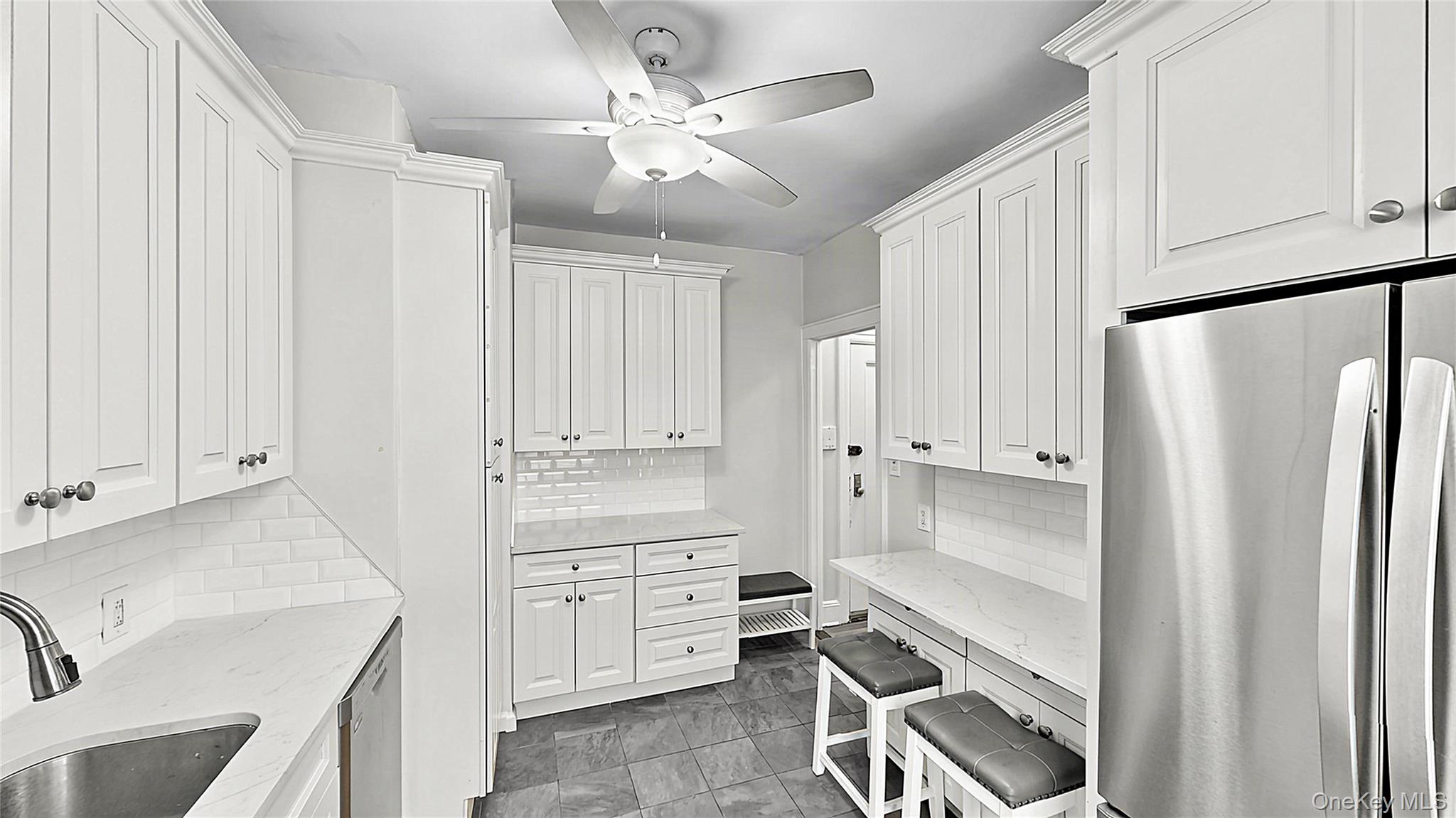Welcome to Laurel Hill Manor, a well-maintained pre-war co-op in the heart of Sunnyside.This spacious true two-bedroom features generously proportioned rooms, high 9-foot ceilings, refinished hardwood floors throughout, fresh paint and excellent storage with four closets. Its convenient first-floor location offers easy everyday access.The renovated kitchen features elegant marble-look quartz countertops, stainless steel appliances, dishwasher, microwave, abundant cabinetry and a convenient breakfast counter with seating for two. Both the kitchen and bathroom are windowed, providing natural light and ventilation. The apartment features eastern and courtyard exposures, with morning light in the bedrooms and windows throughout the home.Enjoy one of Sunnyside's most convenient locations, close to supermarkets, restaurants, bars, cafe's and neighborhood favorites along Queens Boulevard and Greenpoint Avenue. The Sunnyside Greenmarket on Skillman Avenue is also just a few blocks away.The building features a ButterflyMX video intercom system for convenient guest access.Excellent transportation options: just 3 short blocks to the 40th St-Lowery St 7 train, only a few stops to Long Island City and approximately 15 minutes to Grand Central. Greenpoint and Williamsburg are also easily accessible via the B24 bus along Greenpoint Avenue, while nearby Citi Bike stations provide another convenient connection to North Brooklyn.Subletting permitted after two years of owner occupancy with co-op board approval.No pets permitted.